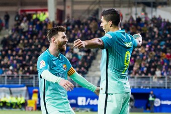 EIBAR, SPAIN - JANUARY 22: Luis Suarez of FC Barcelona celebrates with his teammates  Lionel Messi of FC Barcelona after scoring his team's third goal during the La Liga match between SD Eibar and FC Barcelona at Ipurua Municipal Stadium on January 22, 20