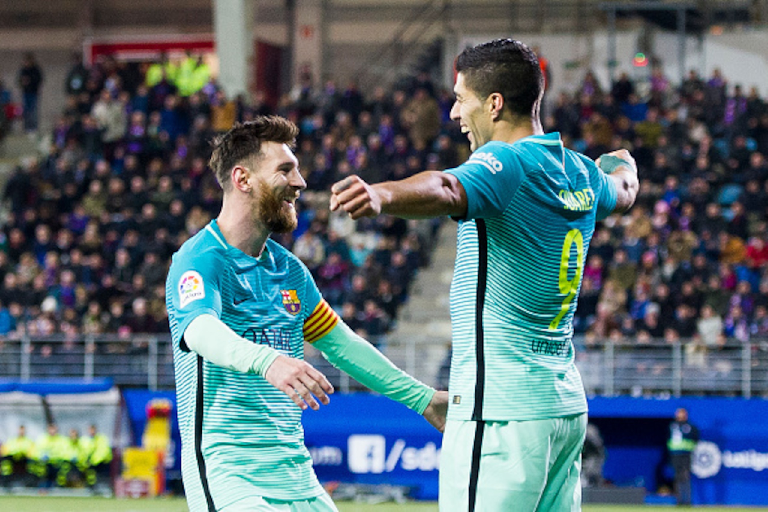 EIBAR, SPAIN - JANUARY 22: Luis Suarez of FC Barcelona celebrates with his teammates  Lionel Messi of FC Barcelona after scoring his team's third goal during the La Liga match between SD Eibar and FC Barcelona at Ipurua Municipal Stadium on January 22, 20