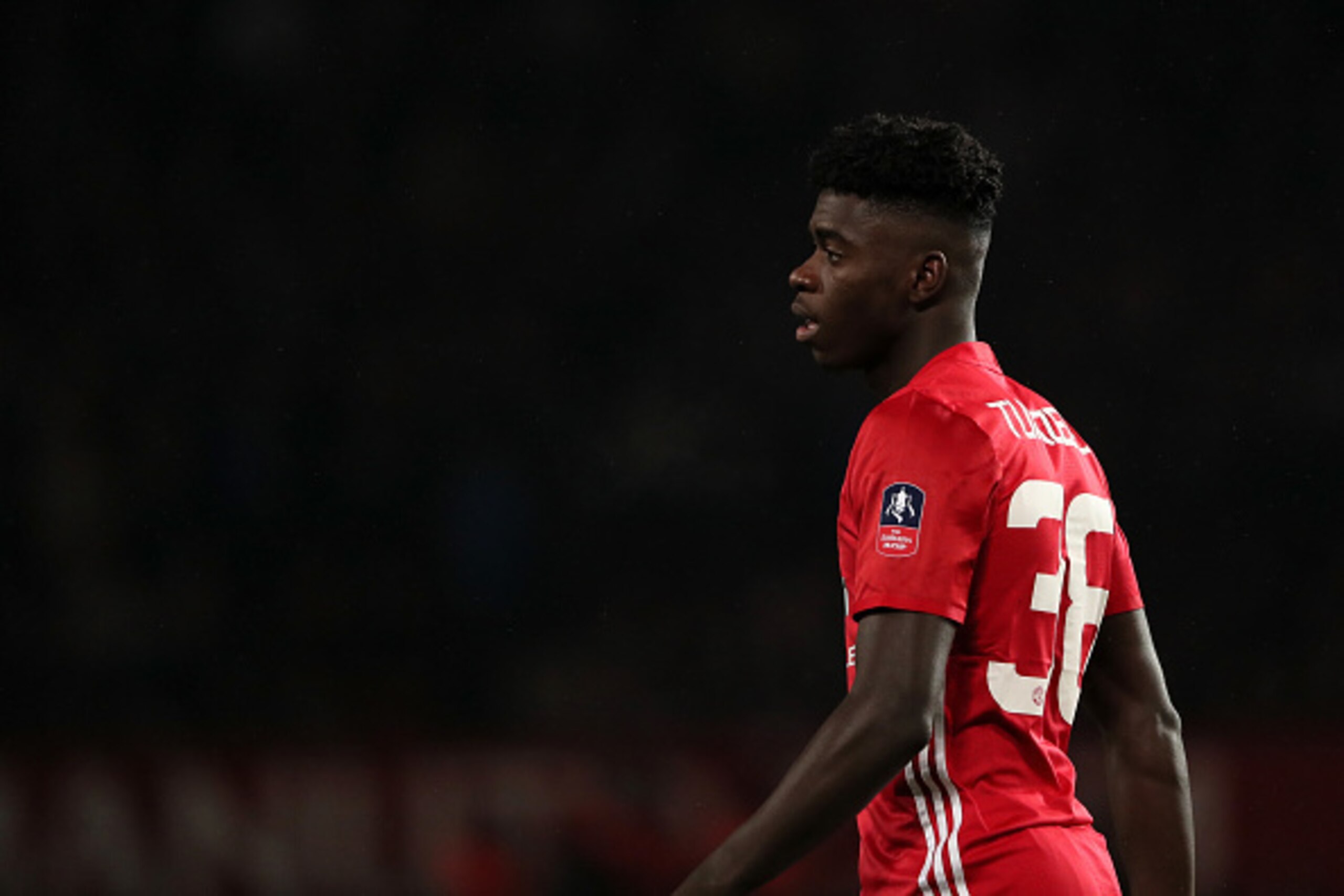 MANCHESTER, ENGLAND - JANUARY 29:  Axel Tuanzebe of Manchester United looks on during the FA Cup fourth round match between Manchester United and Wigan Athletic at Old Trafford on January 29, 2017 in Manchester, England.  (Photo by Matthew Ashton - AMA/Ge
