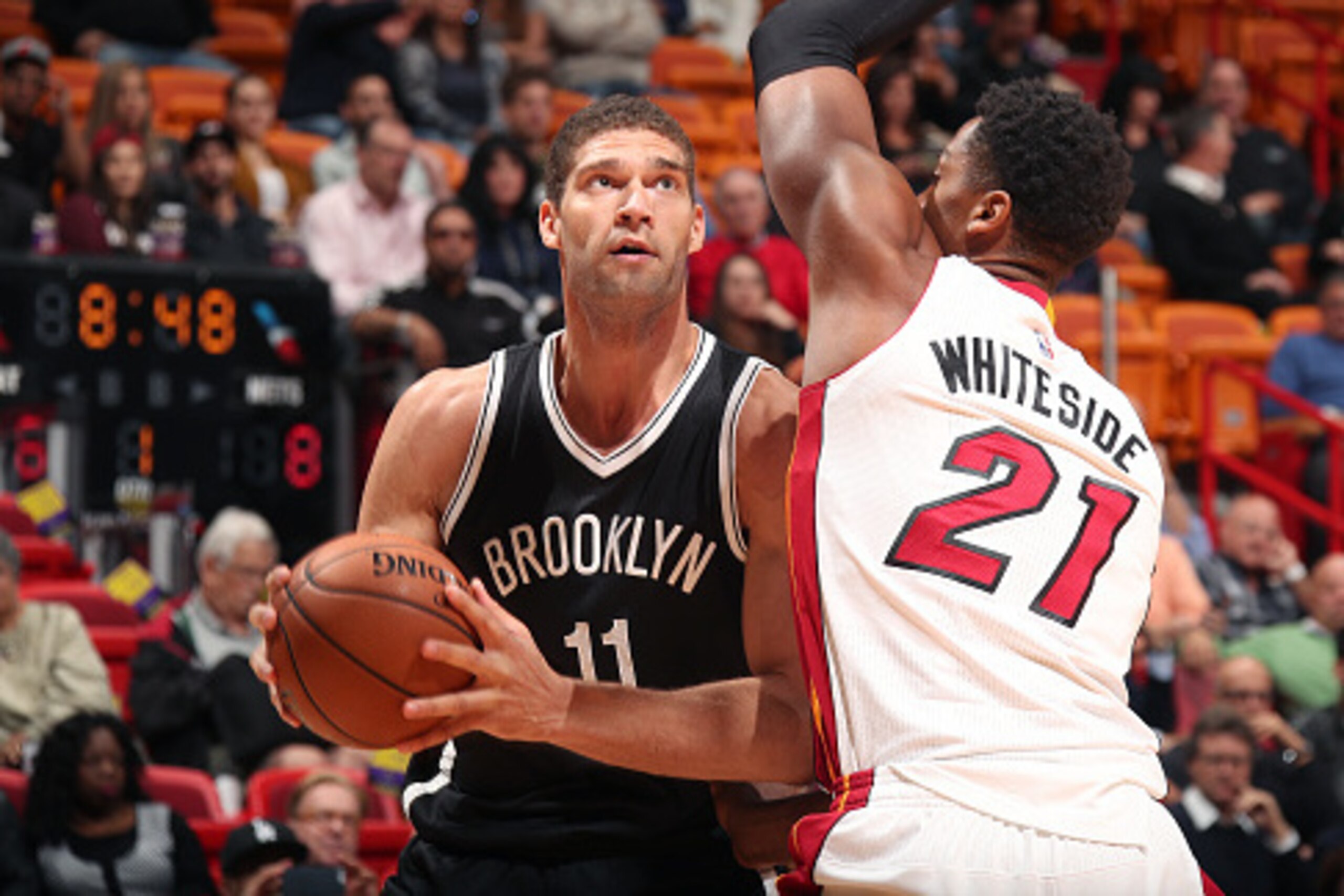 MIAMI, FL - JANUARY 30: Brook Lopez #11 of the Brooklyn Nets drives to the basket against Hassan Whiteside #21 of the Miami Heat on January 30, 2017 at American Airlines Arena in Miami, Florida. NOTE TO USER: User expressly acknowledges and agrees that, b