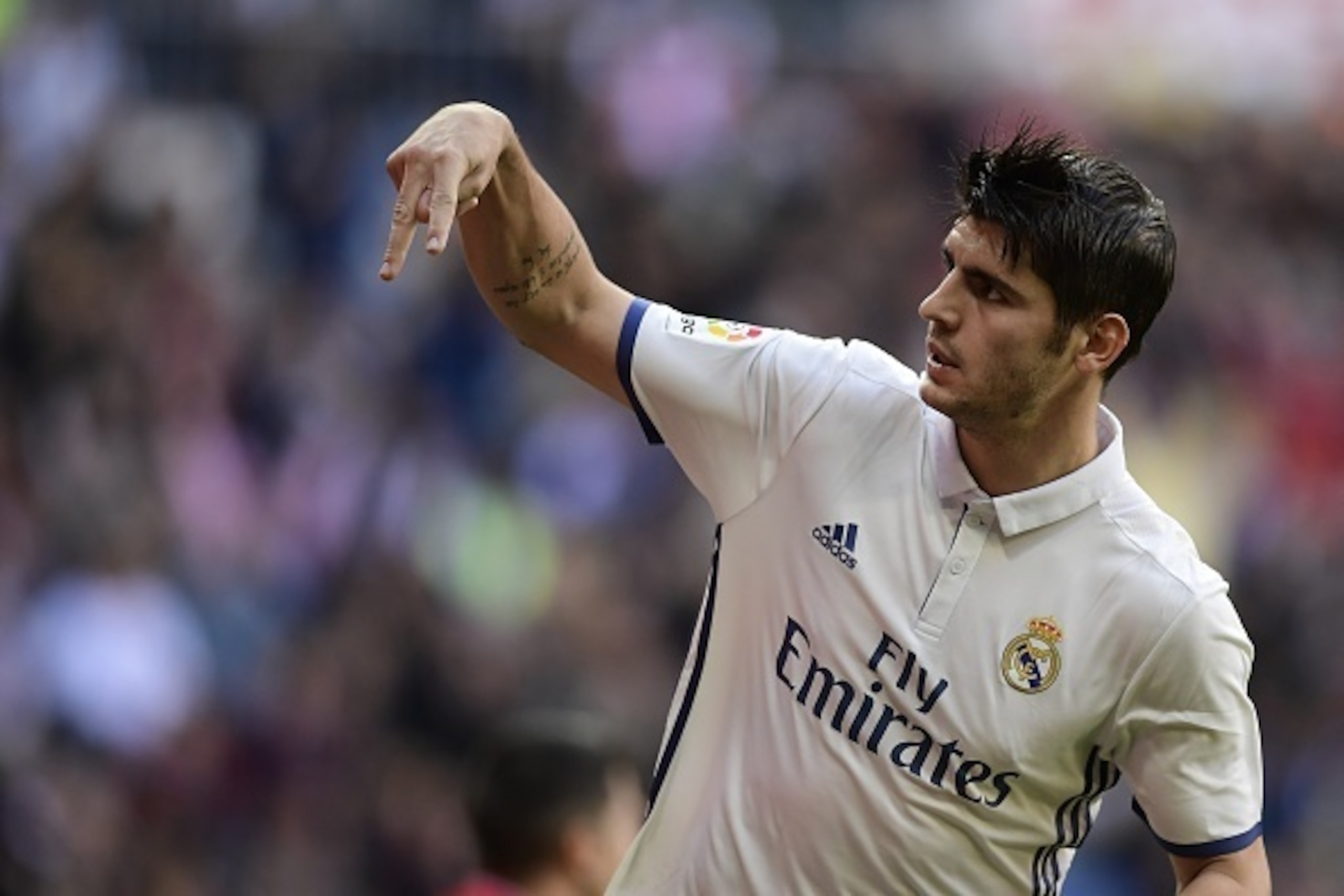 Real Madrid's forward Alvaro Morata celebrates after scoring a goal  during the Spanish league football match Real Madrid CF vs Club Deportivo Leganes SAD at the Santiago Bernabeu stadium in Madrid  on November 6, 2016. / AFP / JAVIER SORIANO        (Phot