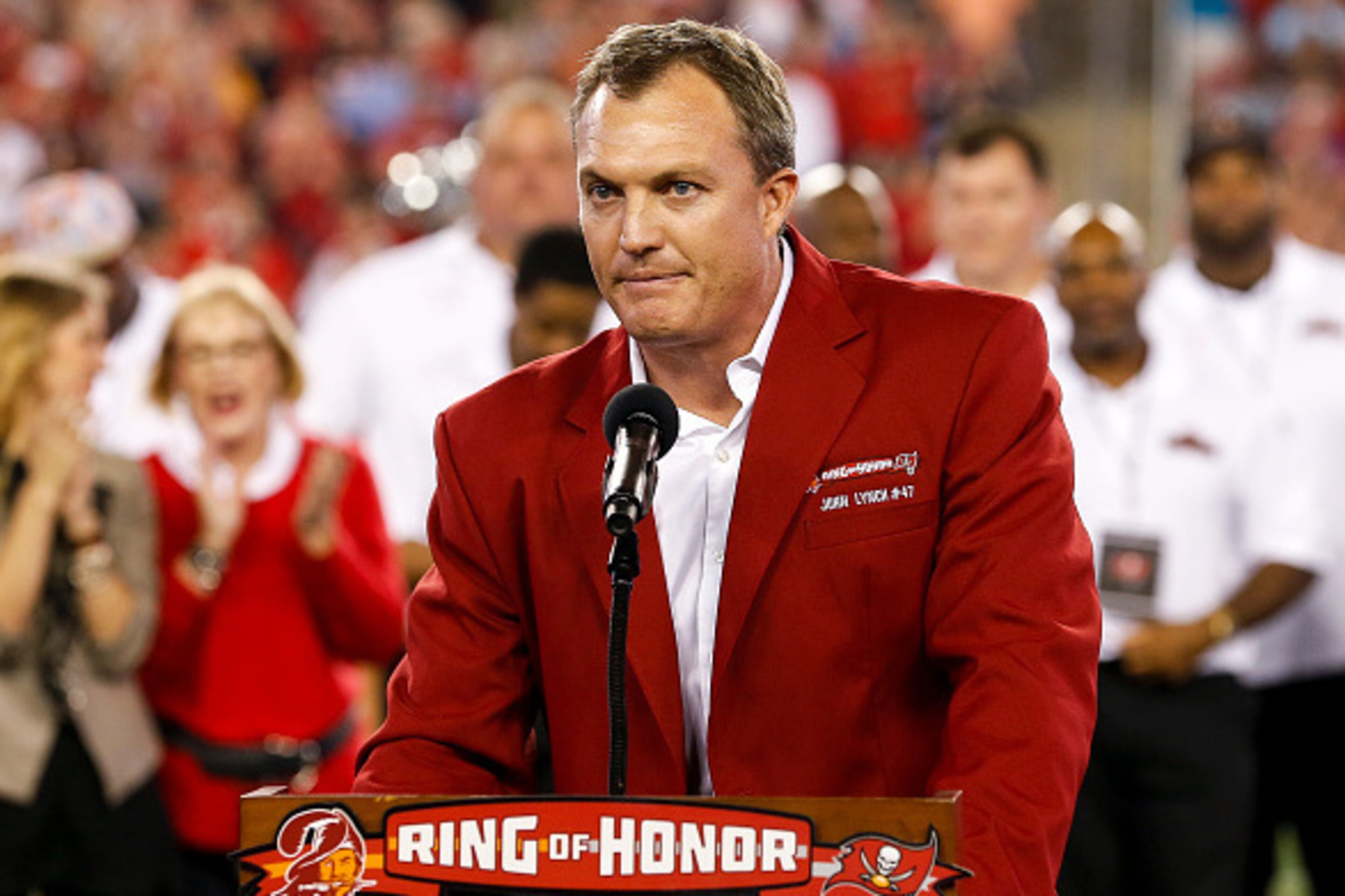 TAMPA, FL - NOVEMBER 3: Former Safety John Lynch of the Tampa Bay Buccaneers address the fans during his induction in the team's Ring of Honor during half-time of the game against the Atlanta Falcons at Raymond James Stadium on November 3, 2016 in Tampa, TAMPA, FL - NOVEMBER 3: Former Safety John Lynch of the Tampa Bay Buccaneers address the fans during his induction in the team's Ring of Honor during half-time of the game against the Atlanta Falcons at Raymond James Stadium on November 3, 2016 in Tampa,