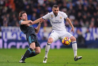 MADRID, SPAIN - JANUARY 29:  Karim Benzema of Real Madrid is tackled by Asier Illarramend of Real Sociedad de Futbol during the La Liga match between Real Madrid CF and Real Sociedad de Futbol at the Bernabeu on January 29, 2017 in Madrid, Spain.  (Photo 