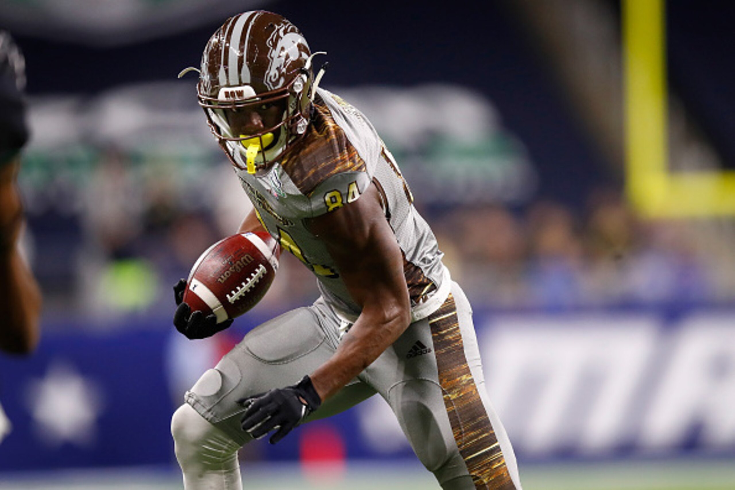 DETROIT, MI - DECEMBER 02: Corey Davis #84 of the Western Michigan Broncos looks for yards after a first half catch while playing the Ohio Bobcats during the MAC Championship on December 2, 2016 at Ford Field in Detroit, Michigan. (Photo by Gregory Shamus