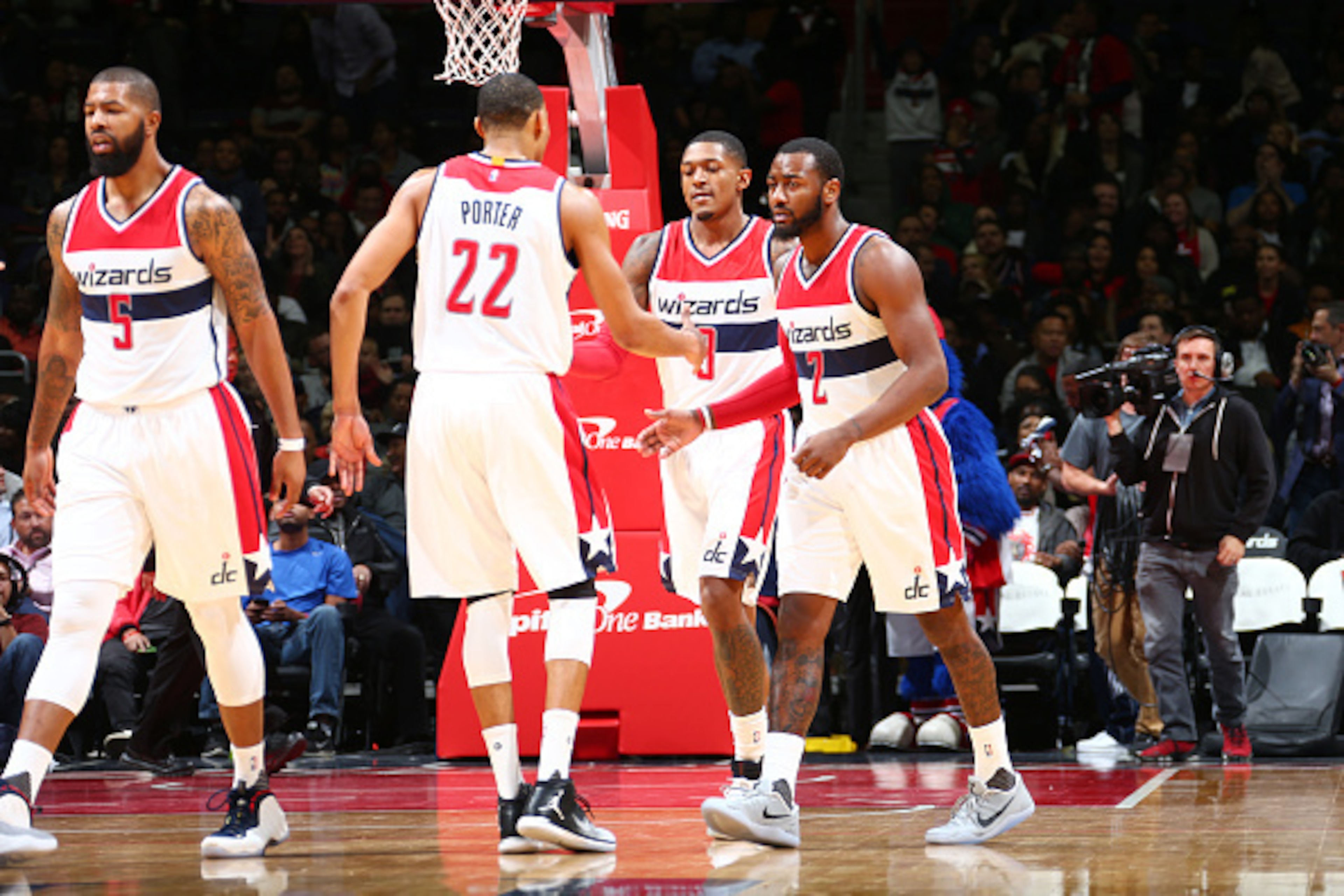WASHINGTON, DC -  NOVEMBER 4:  Otto Porter Jr. #22, John Wall #2, and Bradley Beal #3 of the Washington Wizards celebrate during a game against the Atlanta Hawks on November 4, 2016 at the Verizon Center in Washington, DC. NOTE TO USER: User expressly ack