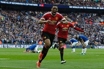 Manchester United's French striker Anthony Martial (C) celebrates after scoring their second goal during the English FA Cup semi-final football match between Everton and Manchester United at Wembley Stadium in London on April 23, 2016. / AFP / ADRIAN DENN