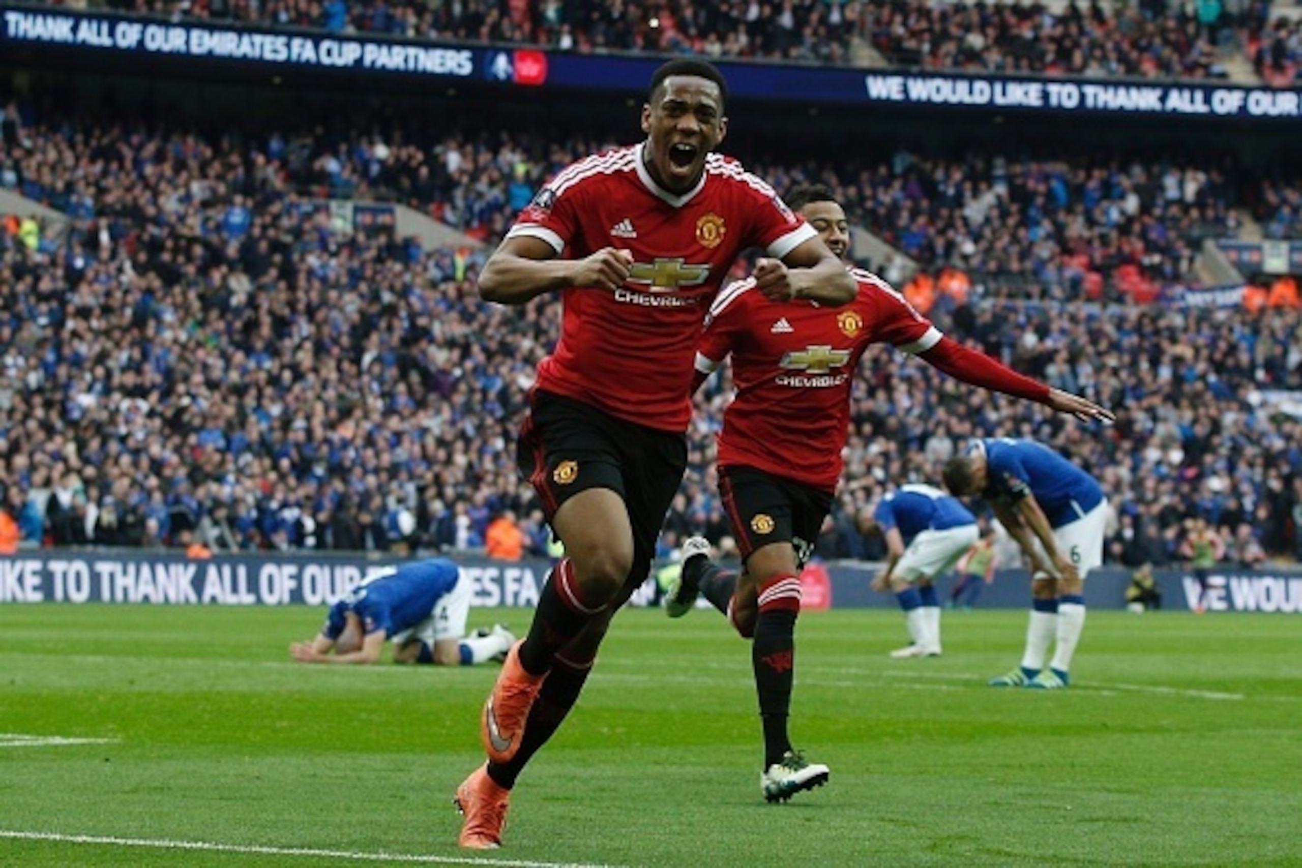 Manchester United's French striker Anthony Martial (C) celebrates after scoring their second goal during the English FA Cup semi-final football match between Everton and Manchester United at Wembley Stadium in London on April 23, 2016. / AFP / ADRIAN DENN Manchester United's French striker Anthony Martial (C) celebrates after scoring their second goal during the English FA Cup semi-final football match between Everton and Manchester United at Wembley Stadium in London on April 23, 2016. / AFP / ADRIAN DENN