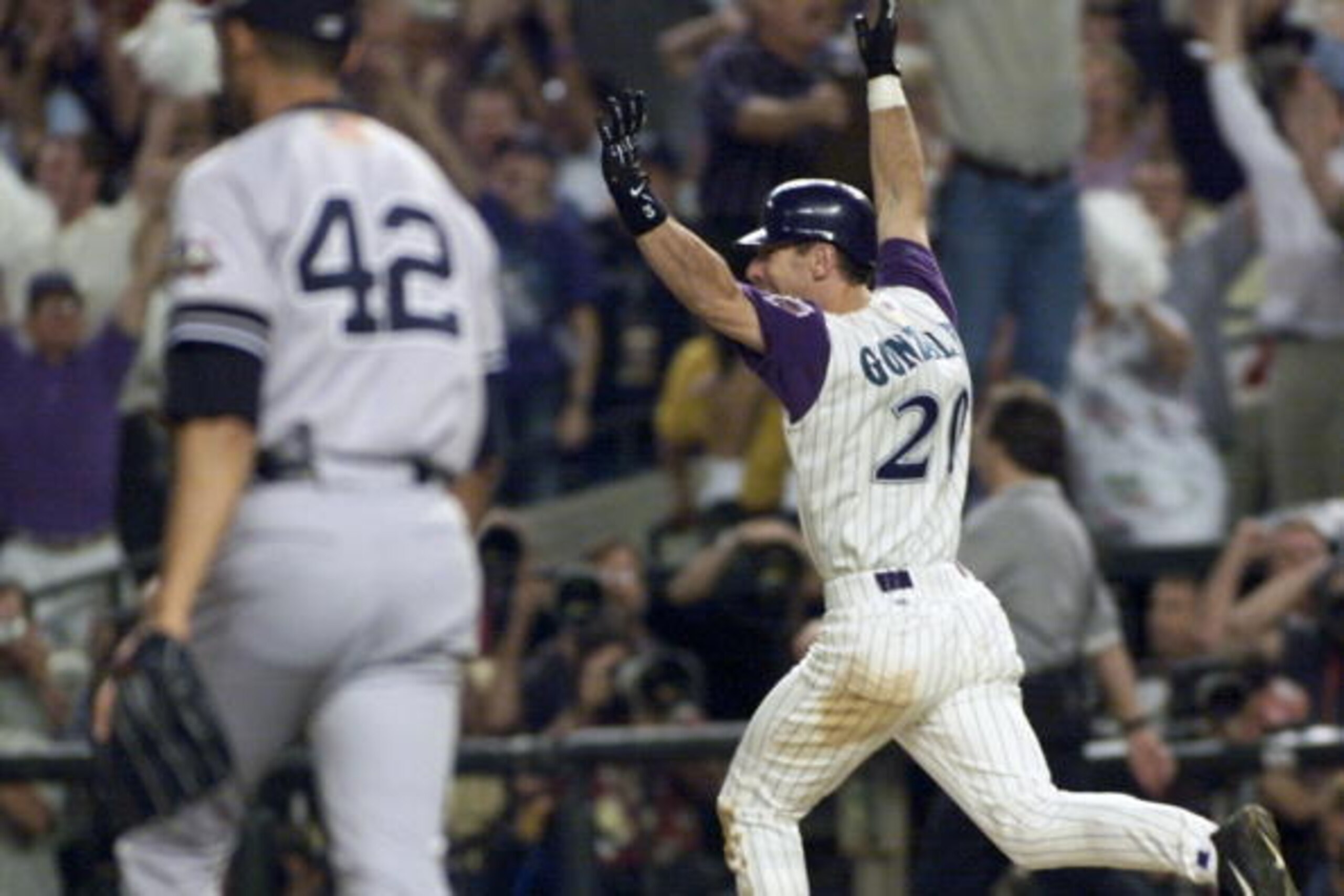PHOENIX, UNITED STATES:  Arizona Diamondbacks left fielder Luis Gonzalez (R) celebrates his game-winning RBI single in the bottom of the 9th inning off of New York Yankees relief pitcher Mariano Rivera (42) during Game 7 of the World Series in Phoenix, AZ