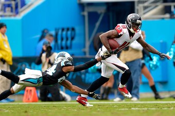CHARLOTTE, NC - NOVEMBER 16:  Josh Norman #24 of the Carolina Panthers dives after Julio Jones #11 of the Atlanta Falcons in the 3rd quarter during their game at Bank of America Stadium on November 16, 2014 in Charlotte, North Carolina.  (Photo by Grant H