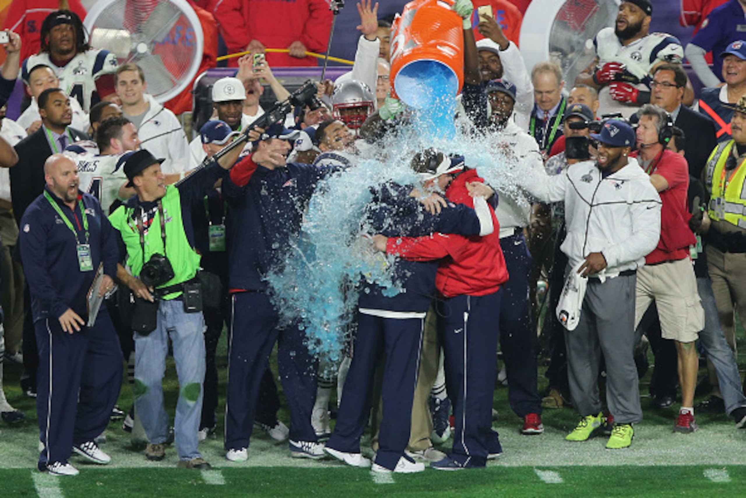 GLENDALE, AZ - FEBRUARY 01:  Head coach Bill Belichick of the New England Patriots gets a Gatorade shower as he celebrates with eefensive coordinator Matt Patricia and offensive coordinator Josh McDaniels near the end of the game against the Seattle Seaha