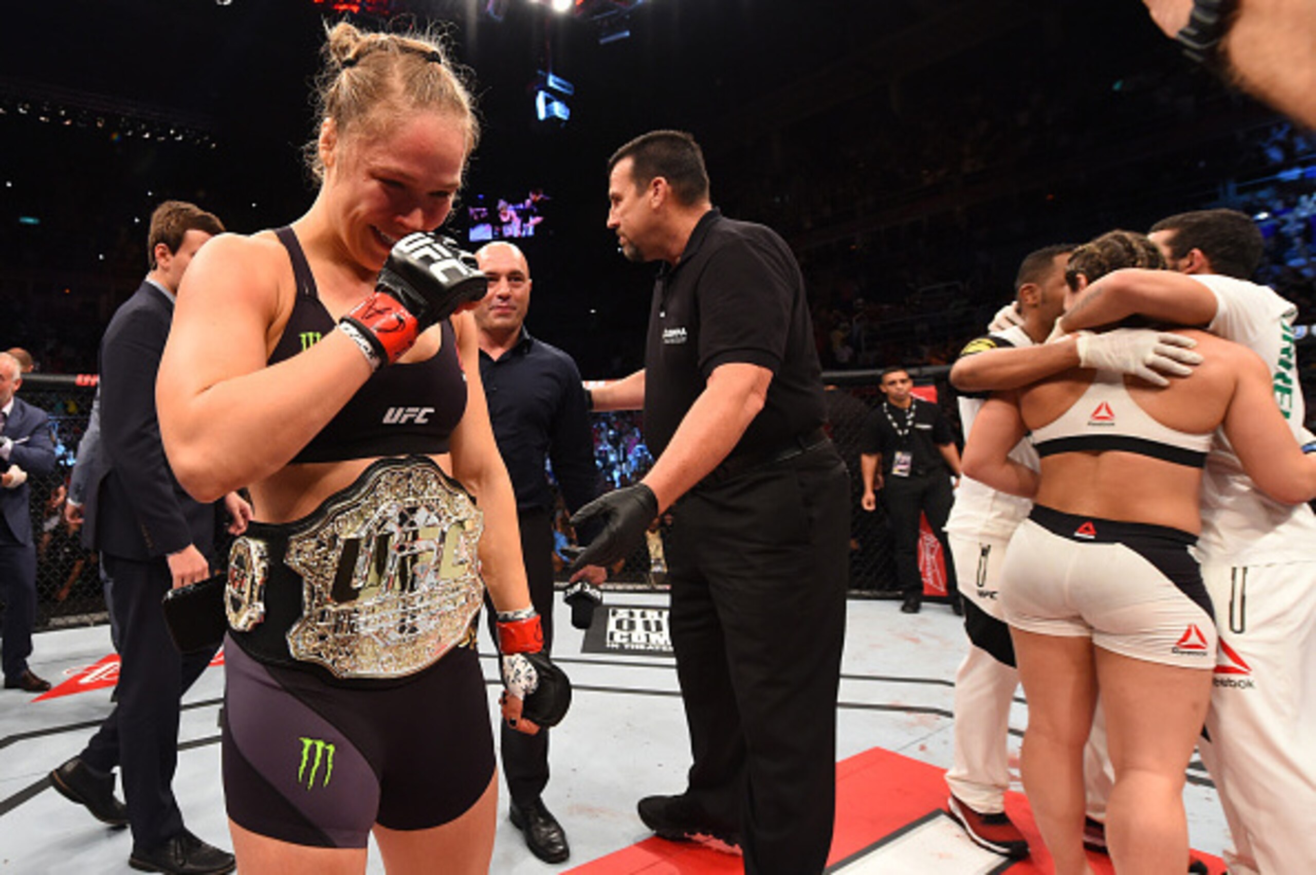 RIO DE JANEIRO, BRAZIL - AUGUST 01:  (L-R) Ronda Rousey of the United States celebrates her knock out victory over Bethe Correia of Brazil in the first round in their UFC women's bantamweight championship bout during the UFC 190 event inside HSBC Arena on