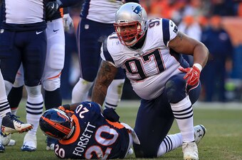 DENVER, CO - DECEMBER 18:  Defensive tackle Alan Branch #97 of the New England Patriots stands up after tackling running back Justin Forsett #20 of the Denver Broncos at Sports Authority Field at Mile High on December 18, 2016 in Denver, Colorado. (Photo 