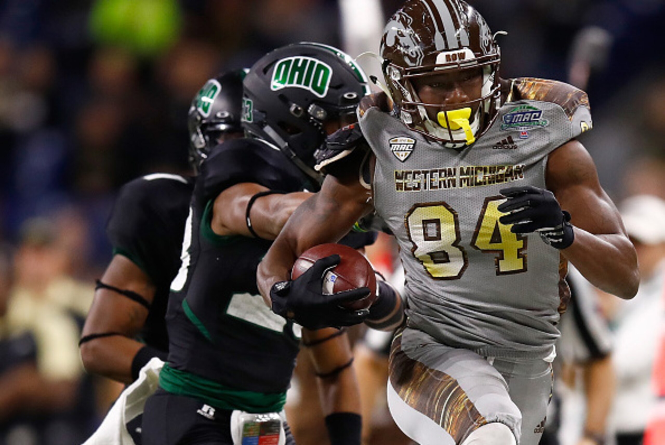 DETROIT, MI - DECEMBER 02: Corey Davis #84 of the Western Michigan Broncos tries to avoid the tackle of Kylan Nelson #23 of the Ohio Bobcats of the Ohio Bobcats after a first half catch during the MAC Championship on December 2, 2016 at Ford Field in Detr