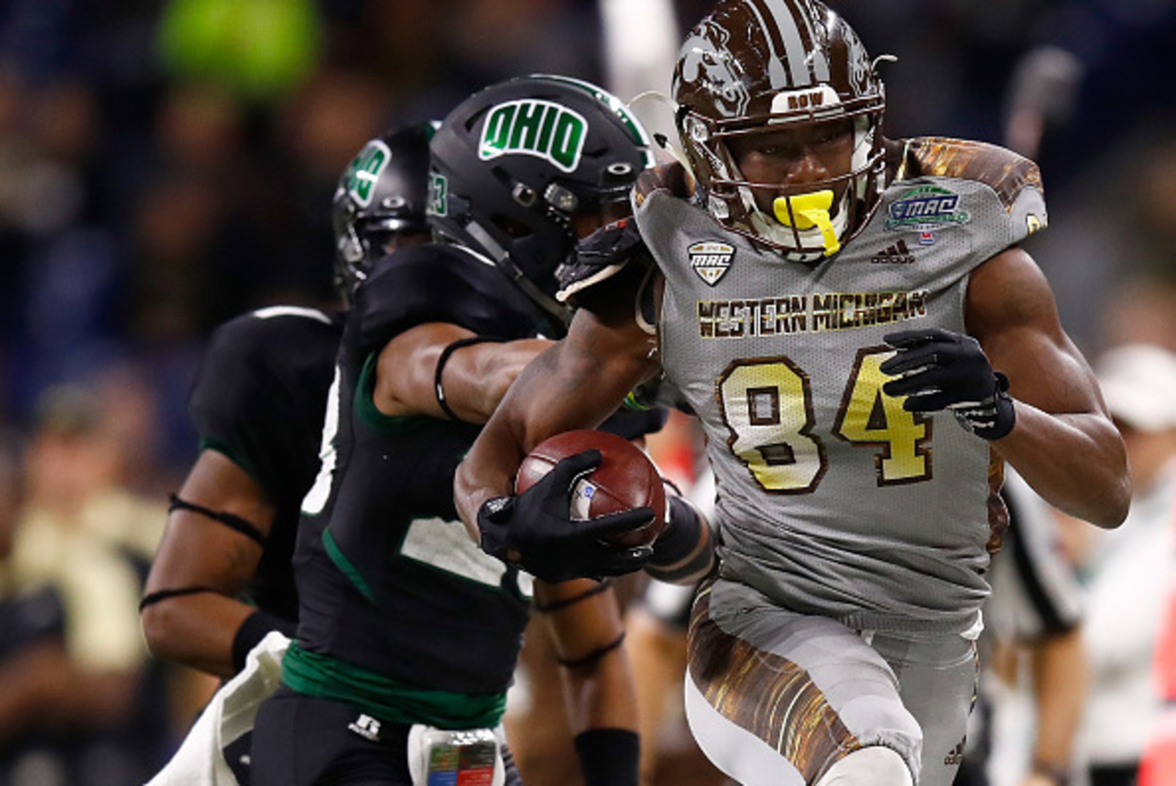 DETROIT, MI - DECEMBER 02: Corey Davis #84 of the Western Michigan Broncos tries to avoid the tackle of Kylan Nelson #23 of the Ohio Bobcats of the Ohio Bobcats after a first half catch during the MAC Championship on December 2, 2016 at Ford Field in Detr