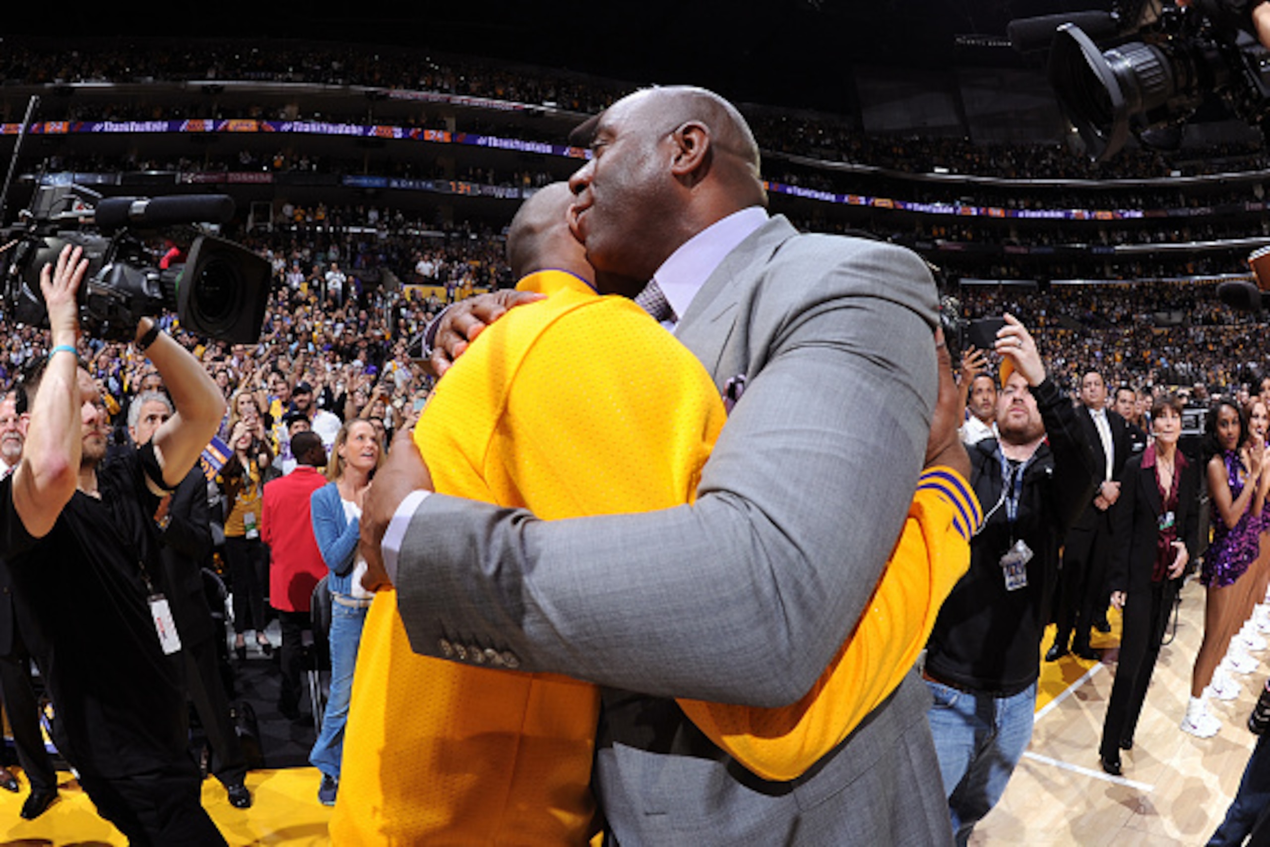 LOS ANGELES, CA - APRIL 13:  Kobe Bryant #24 of the Los Angeles Lakers hugs NBA Legend, Magic Johnson after he introduces him before his last game against the Utah Jazz on April 13, 2016 at Staples Center in Los Angeles, California. NOTE TO USER: User exp