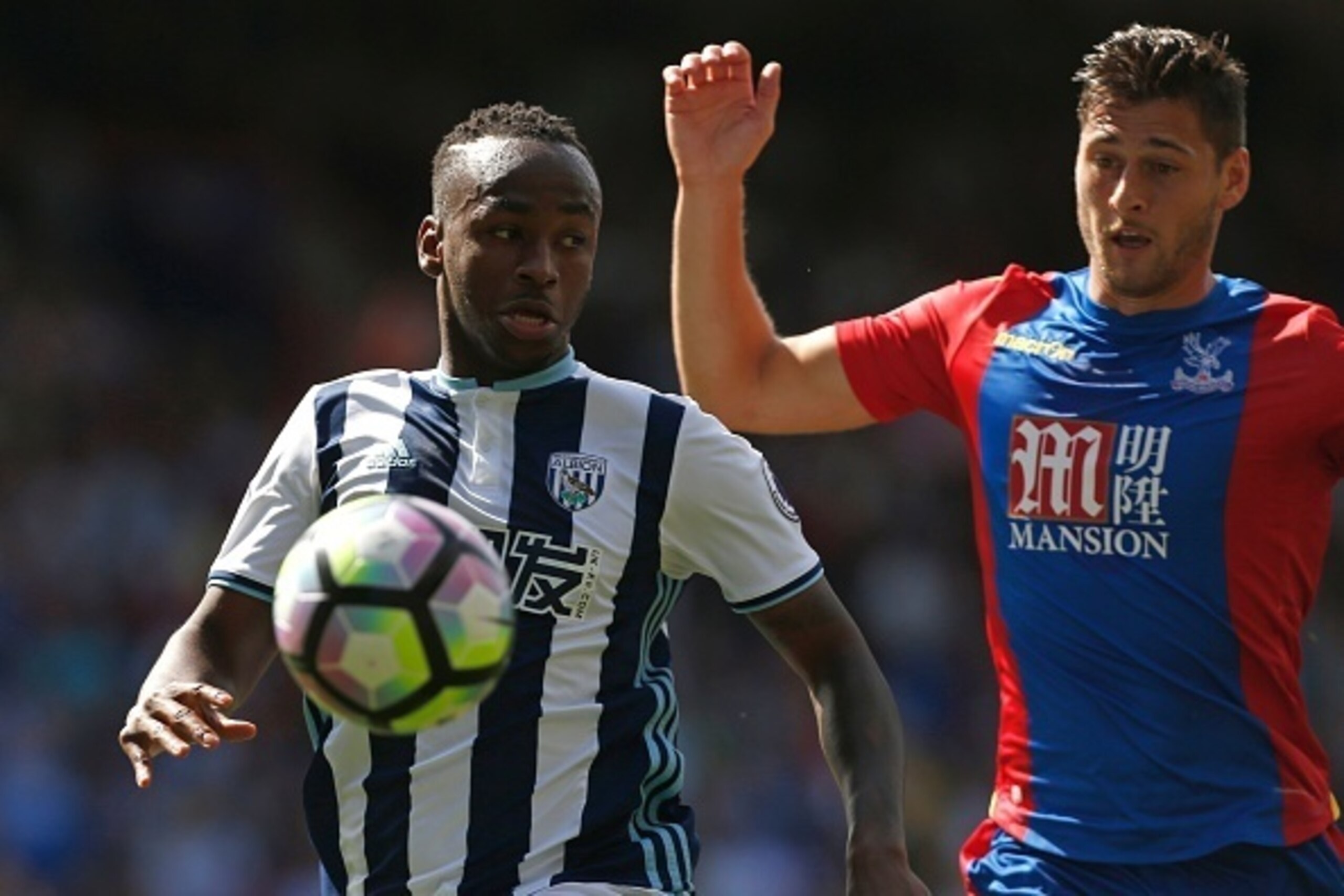 West Bromwich Albion's Burundian-born English striker Saido Berahino (L) vies with Crystal Palace's English defender Joel Ward during the English Premier League football match between Crystal Palace and West Bromwich Albion at Selhurst Park in south Londo