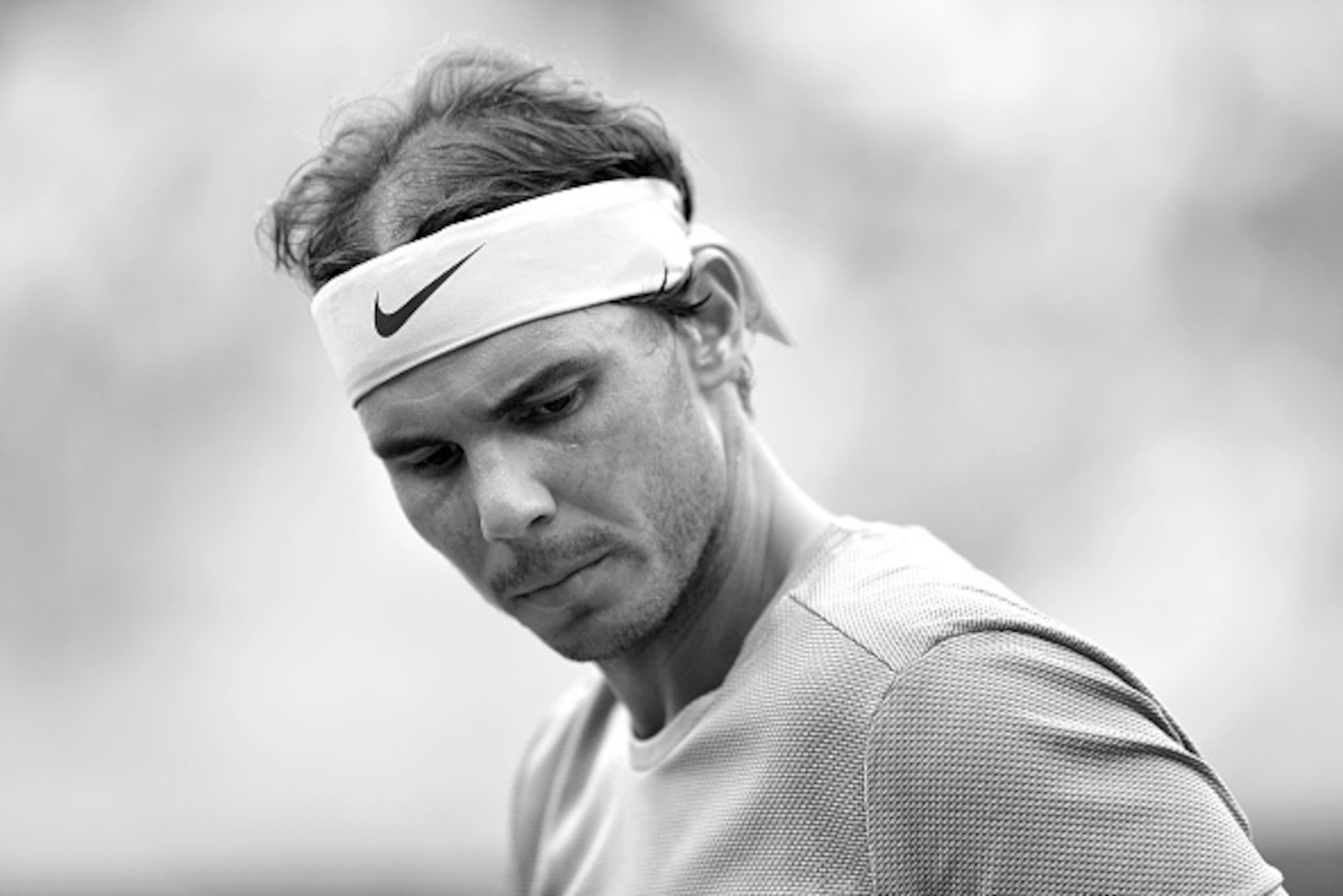 PARIS, FRANCE - MAY 26: (EDITOR'S NOTE: This image was converted to black and white) Rafael Nadal of Spain reacts during his men's single second round match against Facundo Bagnis of Argentina on day five of the 2016 French Open at Roland Garros on May 26 PARIS, FRANCE - MAY 26: (EDITOR'S NOTE: This image was converted to black and white) Rafael Nadal of Spain reacts during his men's single second round match against Facundo Bagnis of Argentina on day five of the 2016 French Open at Roland Garros on May 26