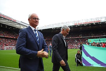 MANCHESTER, ENGLAND - SEPTEMBER 24:  Claudio Ranieri, Manager of Leicester City (L) and Jose Mourinho, Manager of Manchester United (R) make their way to their respective benches prior to kick off  during the Premier League match between Manchester United