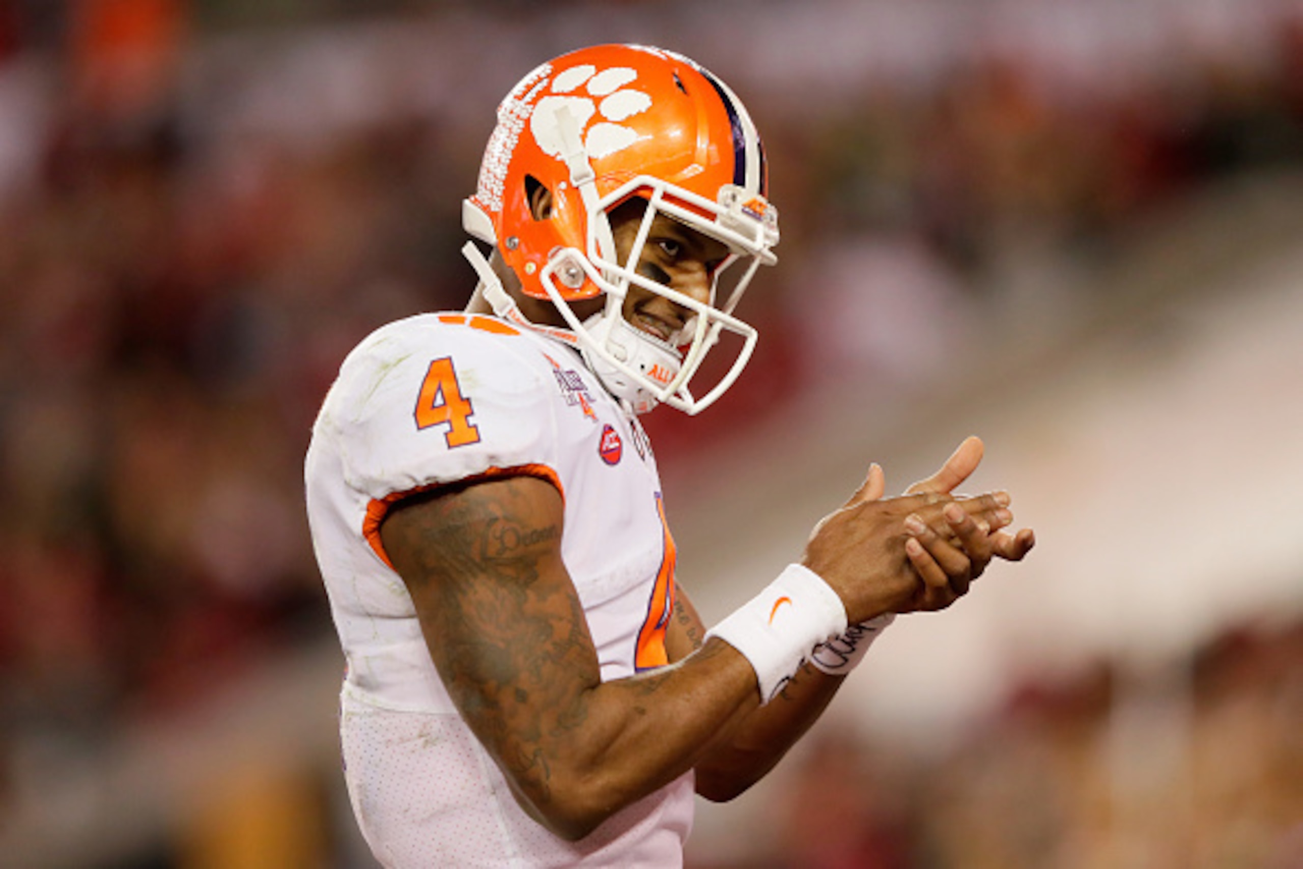 TAMPA, FL - JANUARY 09:  Quarterback Deshaun Watson #4 of the Clemson Tigers celebrates after throwing a 24-yard touchdown pass during the third quarter against the Alabama Crimson Tide in the 2017 College Football Playoff National Championship Game at Ra