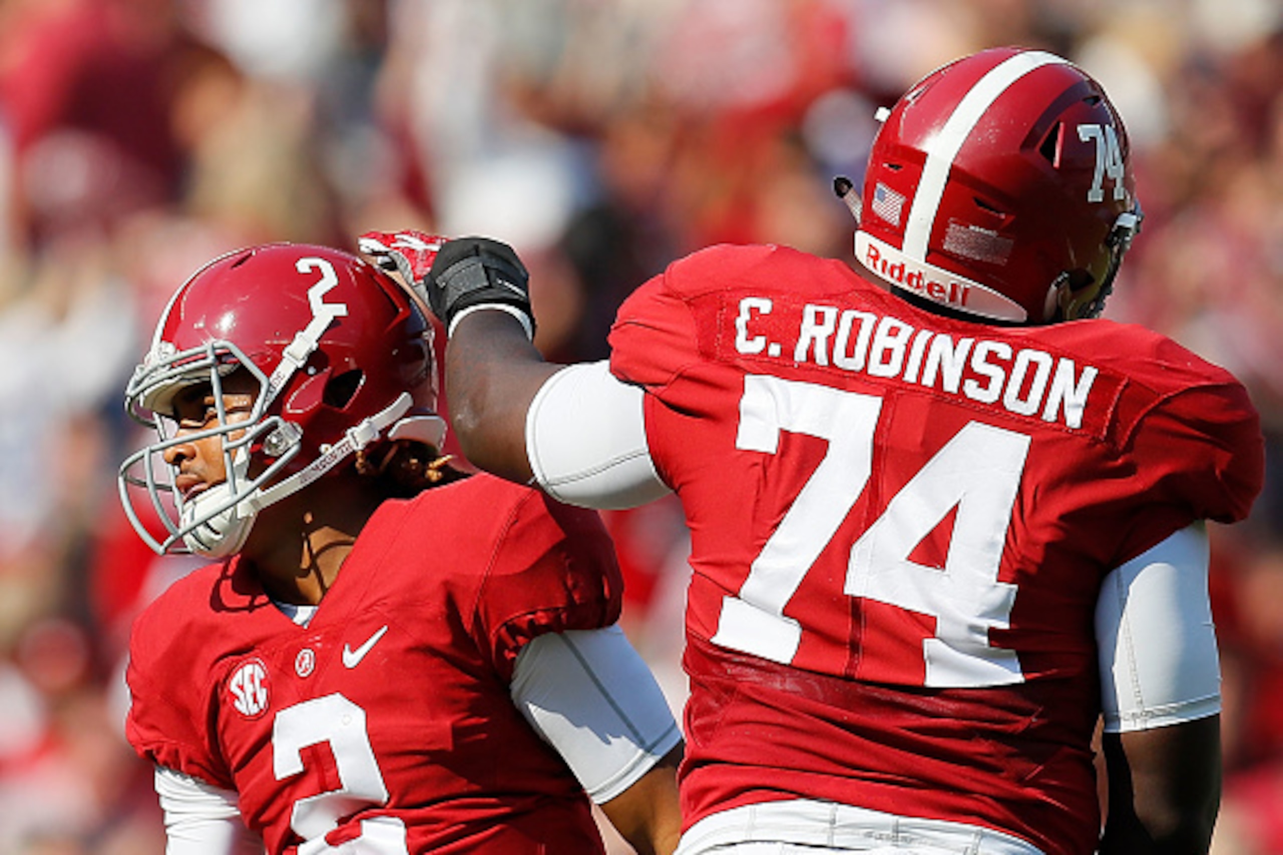 TUSCALOOSA, AL - NOVEMBER 12:  Jalen Hurts #2 of the Alabama Crimson Tide reacts with Cam Robinson #74 after passing for a touchdown against the Mississippi State Bulldogs at Bryant-Denny Stadium on November 12, 2016 in Tuscaloosa, Alabama.  (Photo by Kev