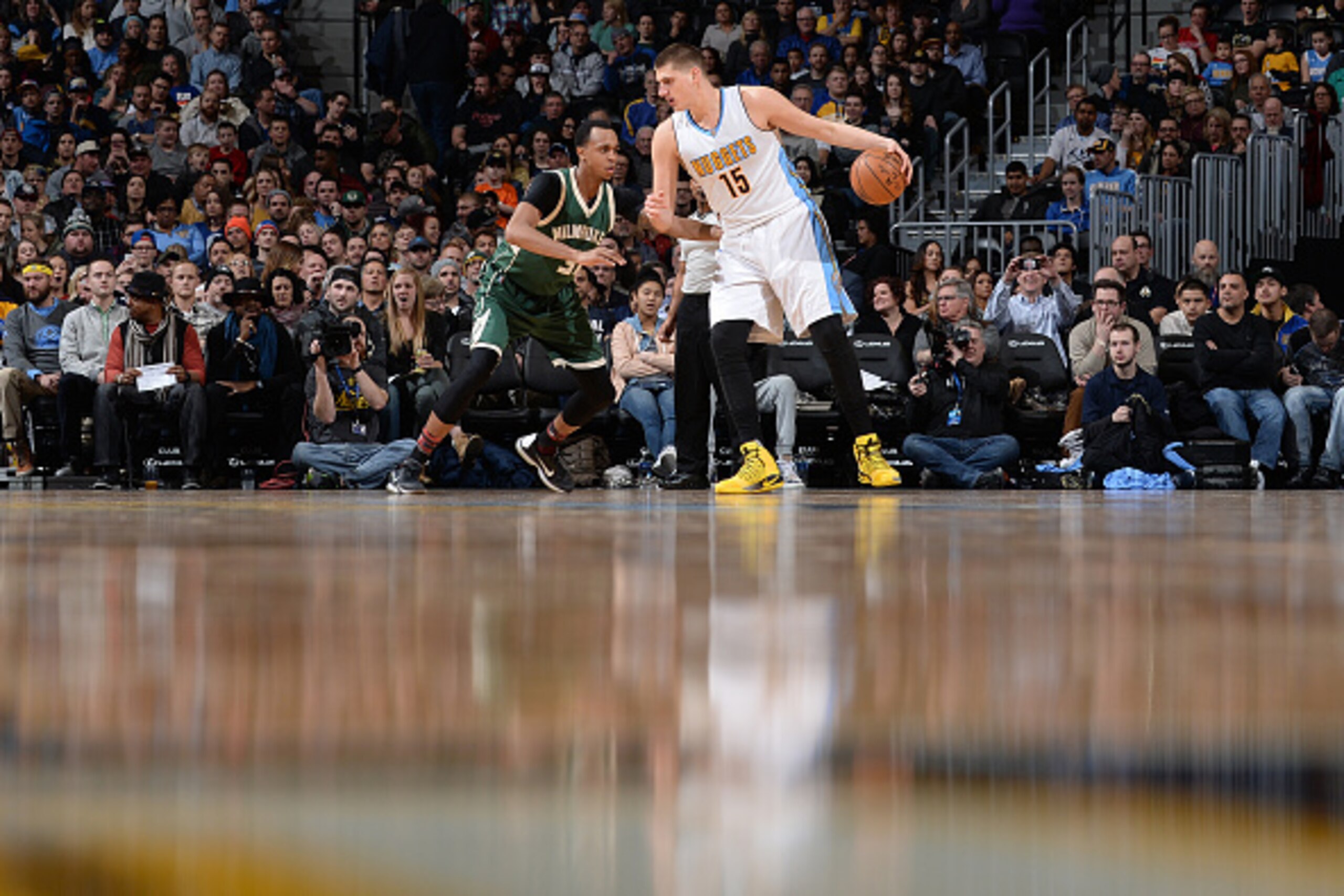 DENVER, CO - FEBRUARY 3: Nikola Jokic #15 of the Denver Nuggets handles the ball against John Henson #31 of the Milwaukee Bucks during the game on February 3, 2017 at the Pepsi Center in Denver, Colorado. NOTE TO USER: User expressly acknowledges and agre