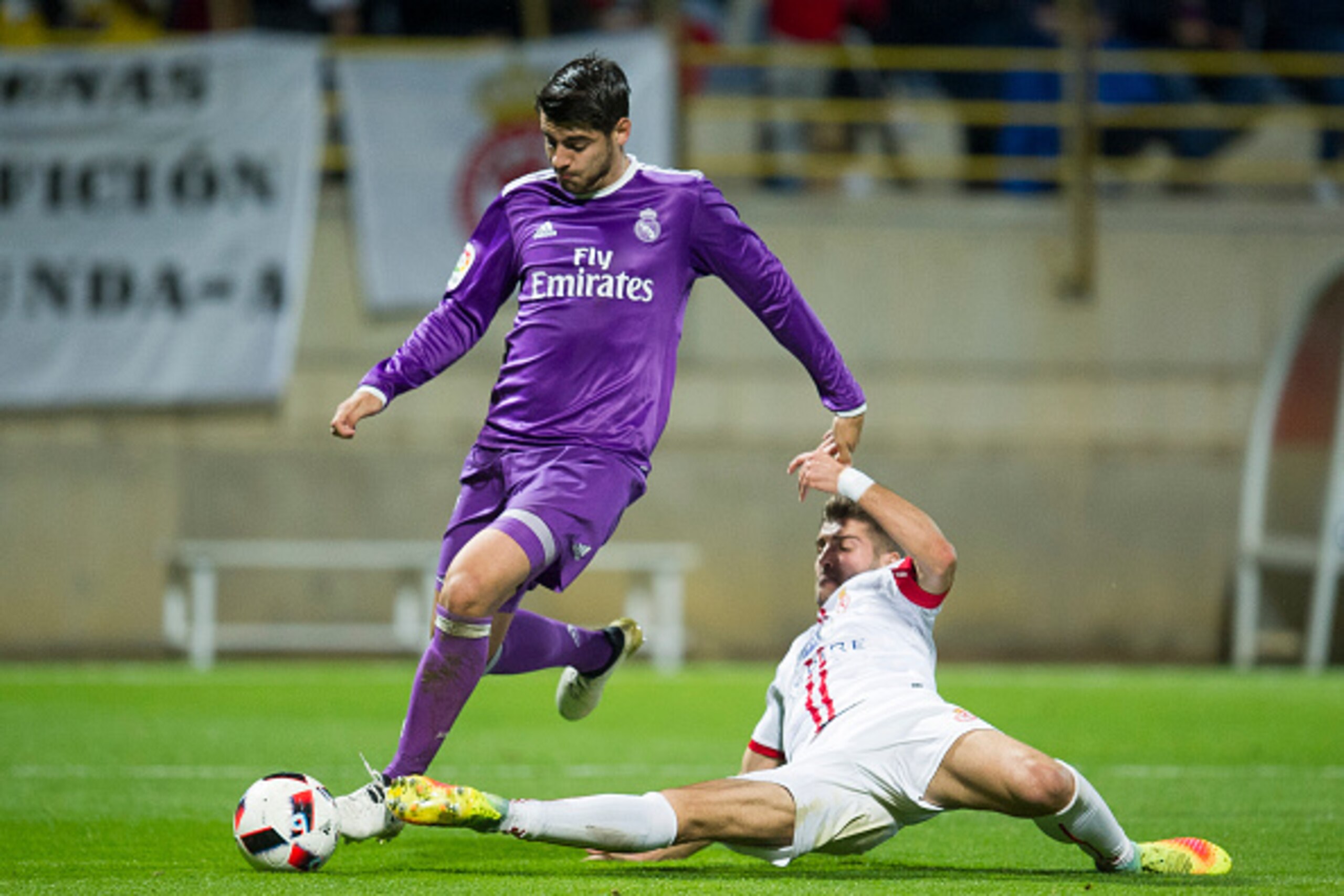 LEON, SPAIN - OCTOBER 26: Alvaro Morata of Real Madrid duels for the ball with Ivan Gonzalez of Cultural Leonesa during the Copa del Rey Round of 32 match between Cultural Leonesa and Real Madrid CF at Reino de Leon Stadium on October 26, 2016 in Leon, Sp