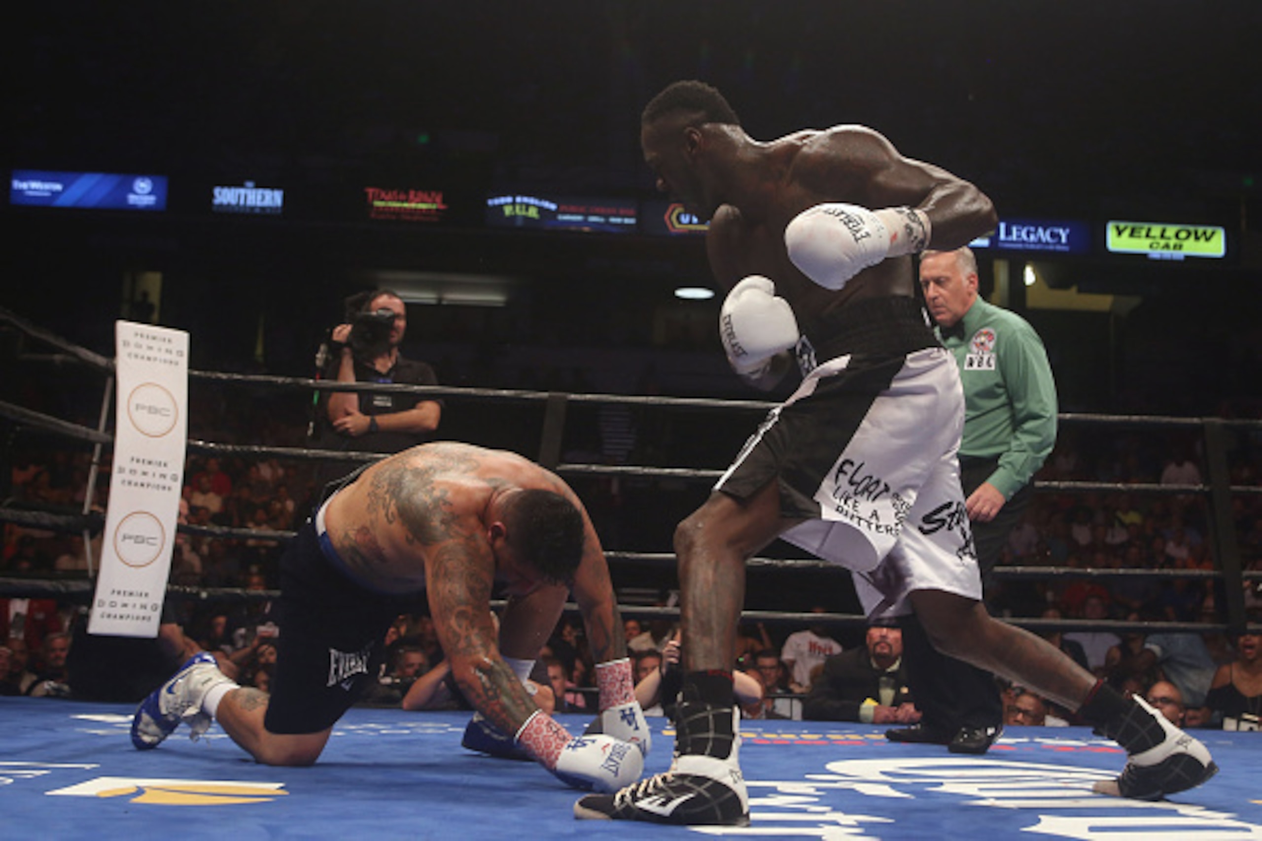 BIRMINGHAM, AL - JULY 16:  Chris Arreola (L) is taken down by WBC World Heavyweight Champion Deontay Wilder (R) during a title fight at Legacy Arena at the BJCC on July 16, 2016 in Birmingham, Alabama.  (Photo by David A. Smith/Getty Images)