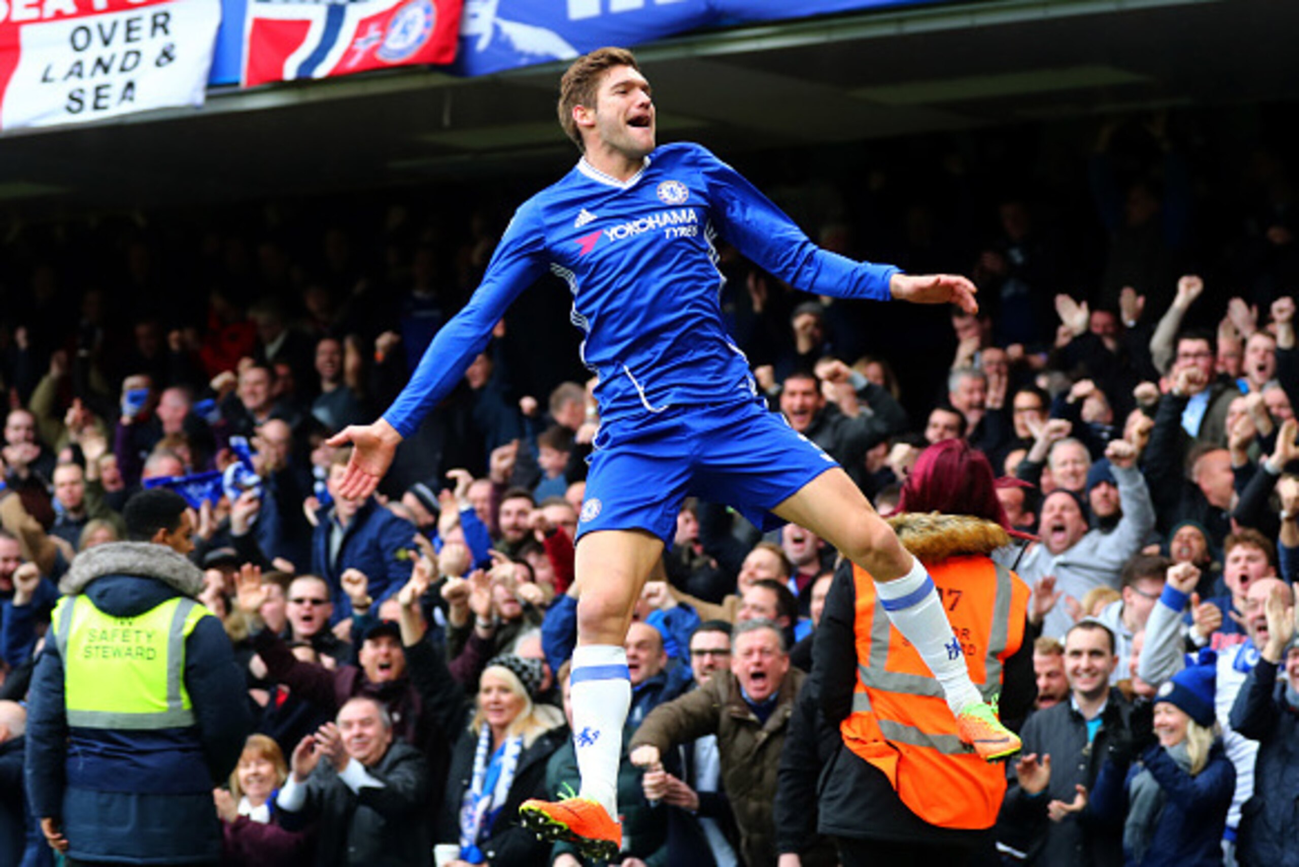 LONDON, ENGLAND - FEBRUARY 04:  Marcos Alonso of Chelsea celebrates after scoring the opening goal during the Premier League match between Chelsea and Arsenal at Stamford Bridge on February 4, 2017 in London, England.  (Photo by Clive Rose/Getty Images)