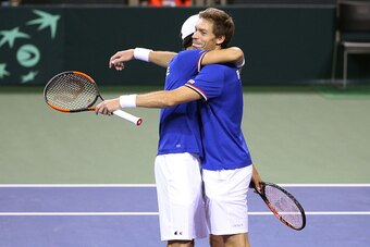 TOKYO, JAPAN - FEBRUARY 4: Pierre-Hughes Herbert and Nicolas Mahut of France celebrate winning the doubles and the tie 3-0 on day 2 of the Davis Cup World Group first round tie between Japan and France at Ariake Coliseum (Ariake Colosseum) on February 4, 