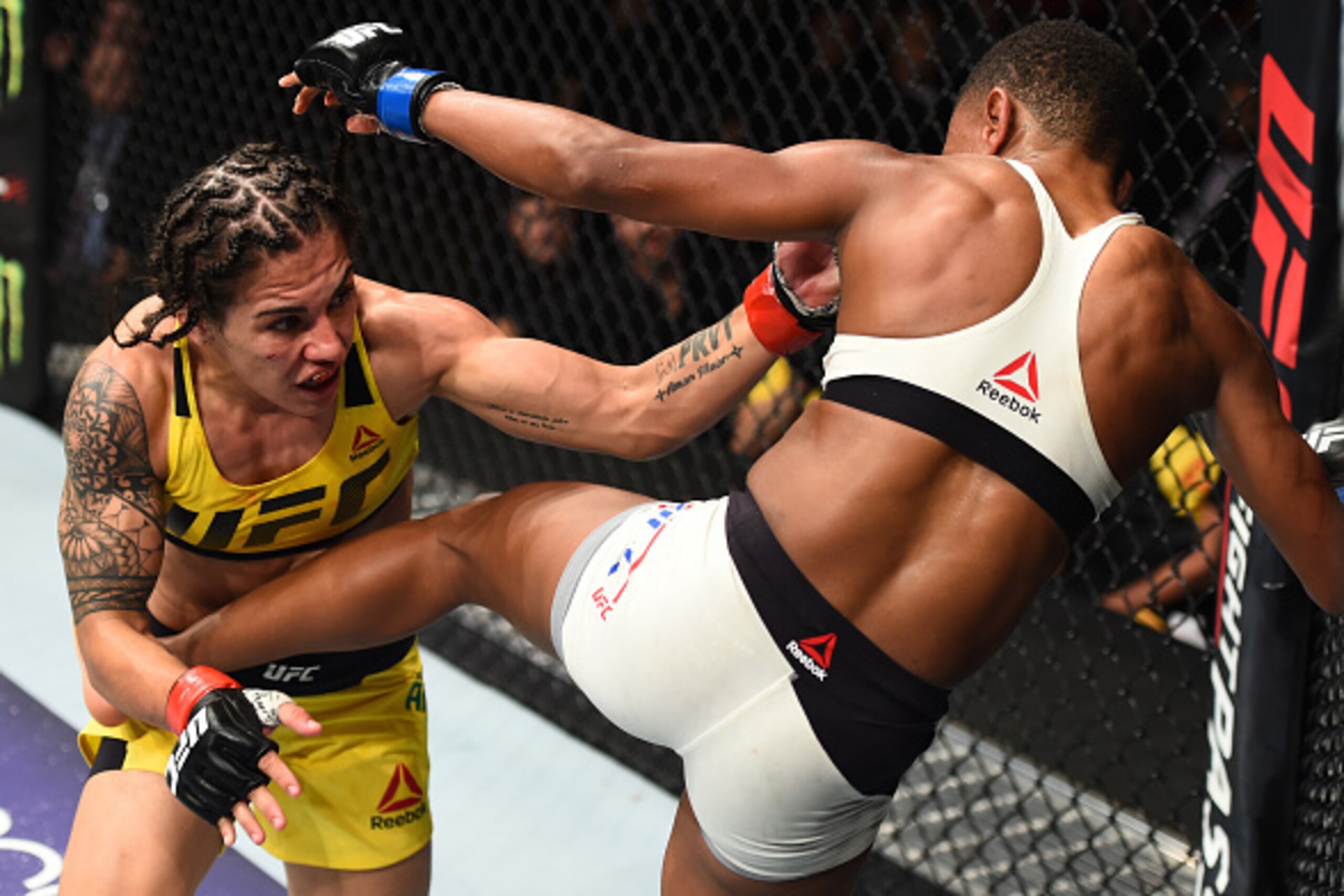 HOUSTON, TX - FEBRUARY 04:  (R-L) Angela Hill kicks Jessica Andrade of Brazil in their women's strawweight bout during the UFC Fight Night event at the Toyota Center on February 4, 2017 in Houston, Texas. (Photo by Jeff Bottari/Zuffa LLC/Zuffa LLC via Get