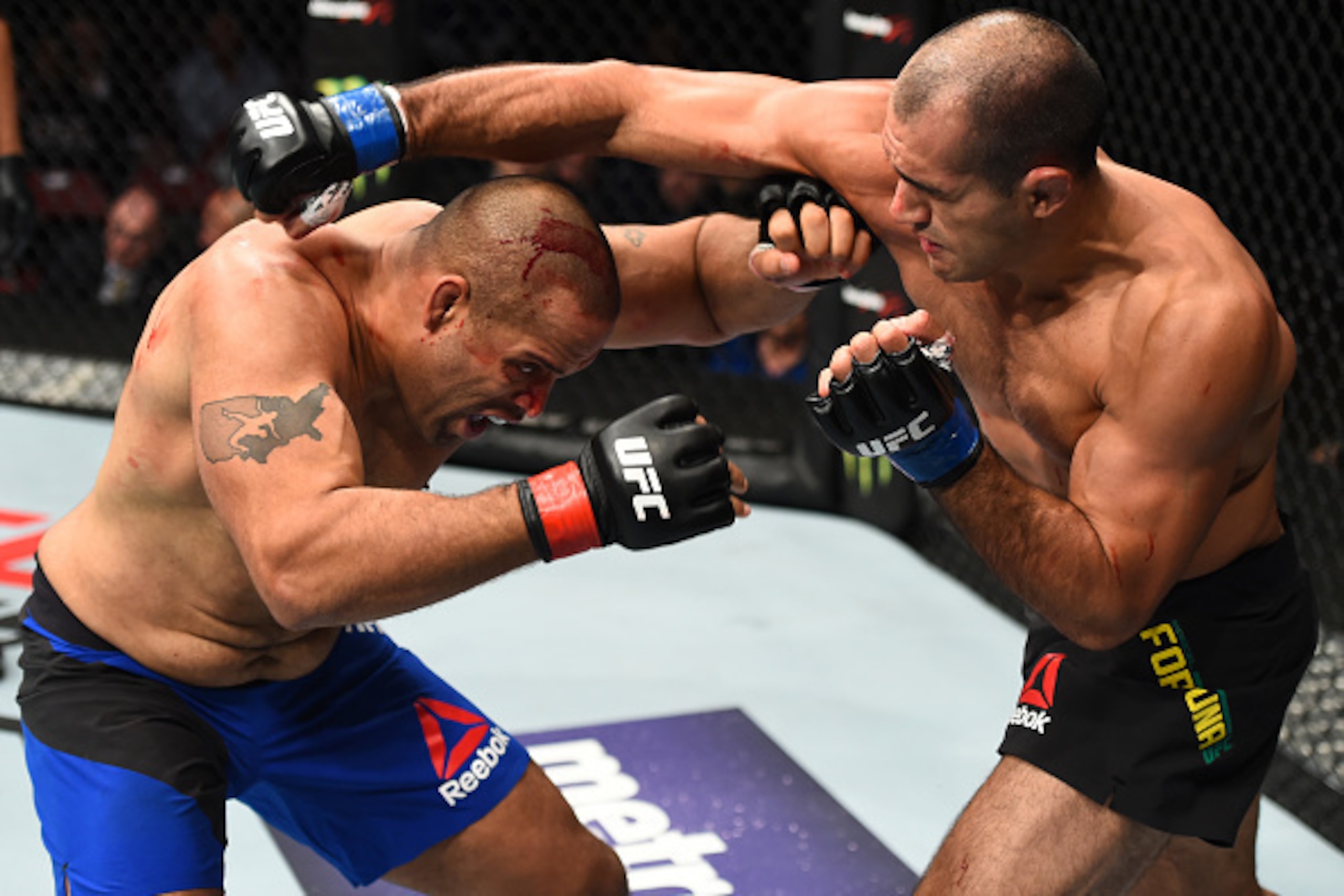 HOUSTON, TX - FEBRUARY 04:  (R-L) Marcel Fortuna of Brazil punches Anthony Hamilton in their heavyweight bout during the UFC Fight Night event at the Toyota Center on February 4, 2017 in Houston, Texas. (Photo by Jeff Bottari/Zuffa LLC/Zuffa LLC via Getty