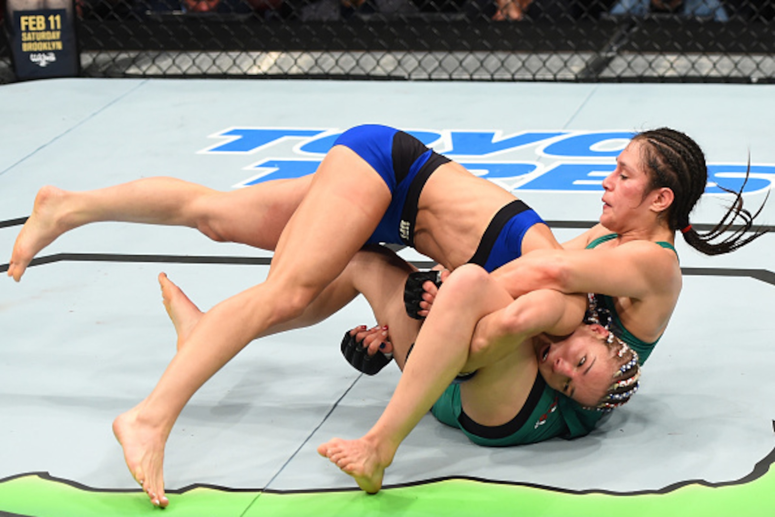 HOUSTON, TX - FEBRUARY 04:  (L-R) Felice Herrig takes down Alexa Grasso of Mexico in their women's strawweight bout during the UFC Fight Night event at the Toyota Center on February 4, 2017 in Houston, Texas. (Photo by Jeff Bottari/Zuffa LLC/Zuffa LLC via