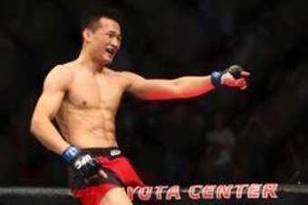 Feb 4, 2017; Houston, TX, USA; Chan Sung Jung (blue gloves) defeats Dennis Bermudez by knockout during UFC Fight Night at Toyota Center. Mandatory Credit: Mark J. Rebilas-USA TODAY Sports