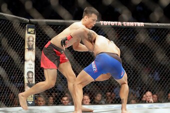 HOUSTON, TX - FEBRUARY 04:  Chan Sung Jung of South Korea fights Dennis Bermudez in the first round of their featherweight bout during the UFC Fight Night event at the Toyota Center on February 4, 2017 in Houston, Texas. (Photo by Tim Warner/Getty Images)