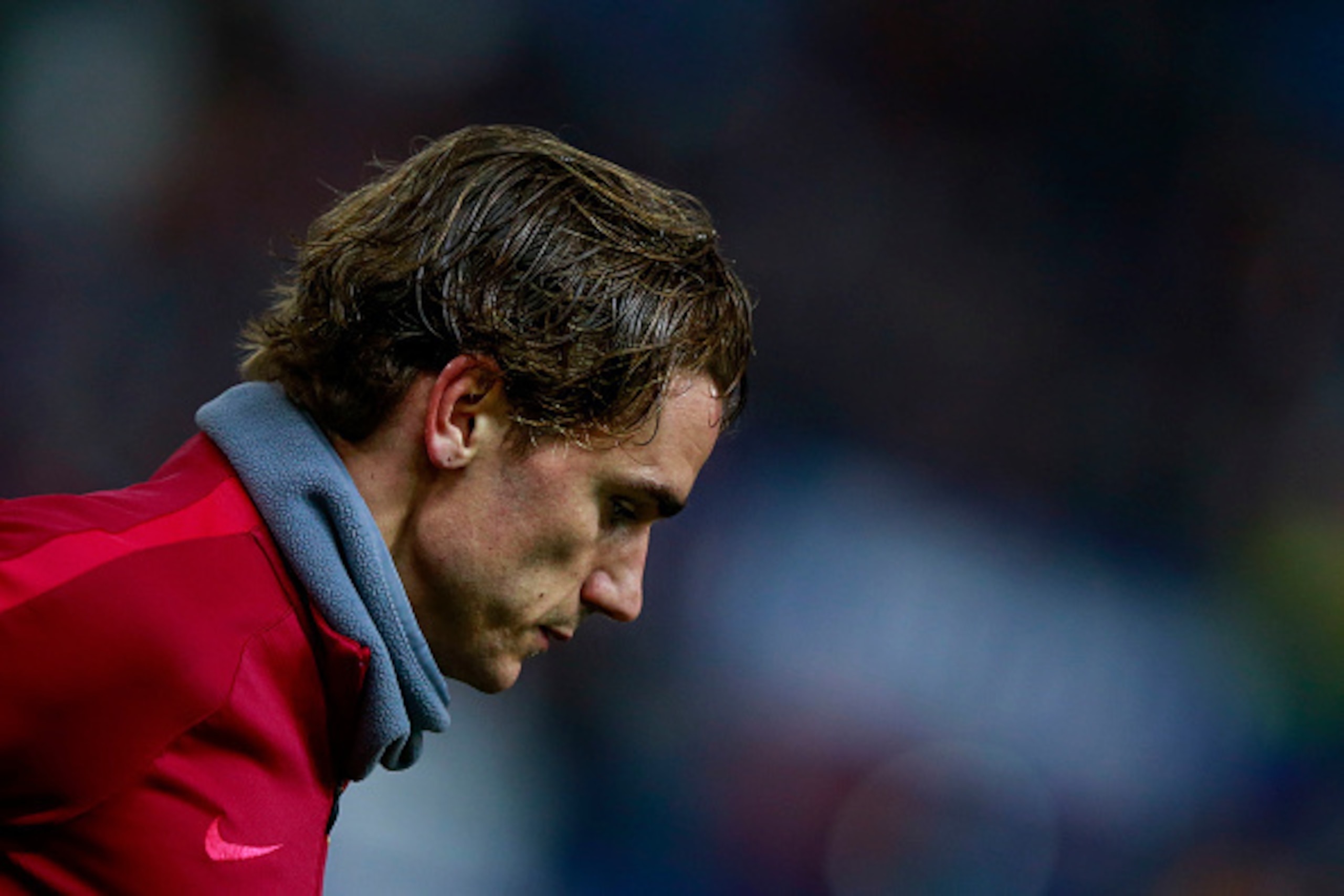 MADRID, SPAIN - FEBRUARY 01: Antoine Griezmann of Atletico de Madrid leaves the pitch after his warming up prior to start the Copa del Rey semi-final first leg match between Club Atletico de Madrid and FC Barcelona at Estadio Vicente Calderon on February 