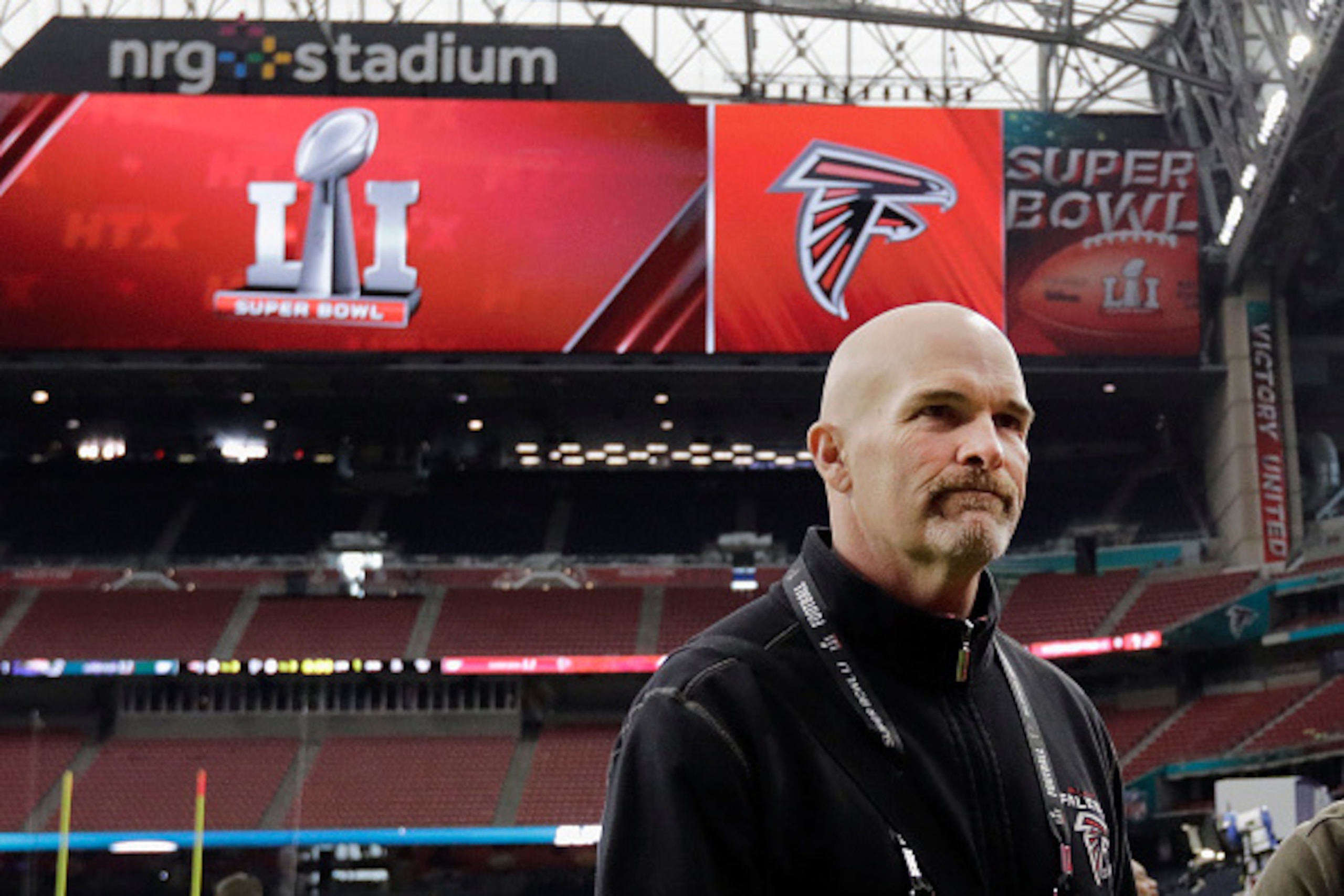 HOUSTON, TX - FEBRUARY 04:  Head coach Dan Quinn of the Atlanta Falcons walks on the field during the Super Bowl LI team walk through at NRG Stadium on February 4, 2017 in Houston, Texas.  (Photo by Tim Warner/Getty Images)