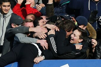 Chelsea's Italian head coach Antonio Conte celebrates with the crowd after Chelsea's Belgian midfielder Eden Hazard scored their second goal during the English Premier League football match between Chelsea and Arsenal at Stamford Bridge in London on Febru Chelsea's Italian head coach Antonio Conte celebrates with the crowd after Chelsea's Belgian midfielder Eden Hazard scored their second goal during the English Premier League football match between Chelsea and Arsenal at Stamford Bridge in London on Febru