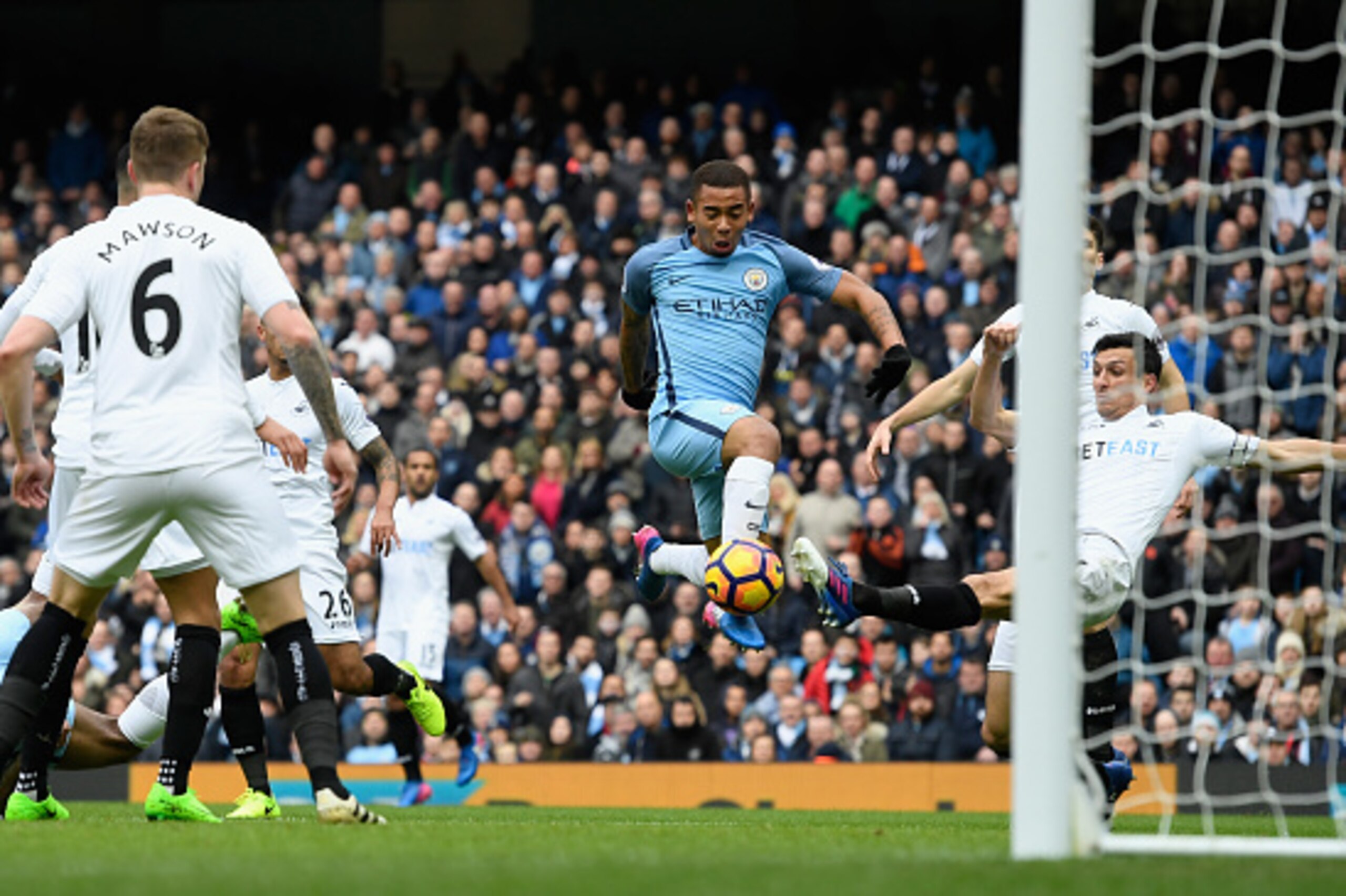 MANCHESTER, ENGLAND - FEBRUARY 05:  Manchester City player Gabriel Jesus scores the opening goal during the Premier League match between Manchester City and Swansea City at Etihad Stadium on February 5, 2017 in Manchester, England.  (Photo by Stu Forster/