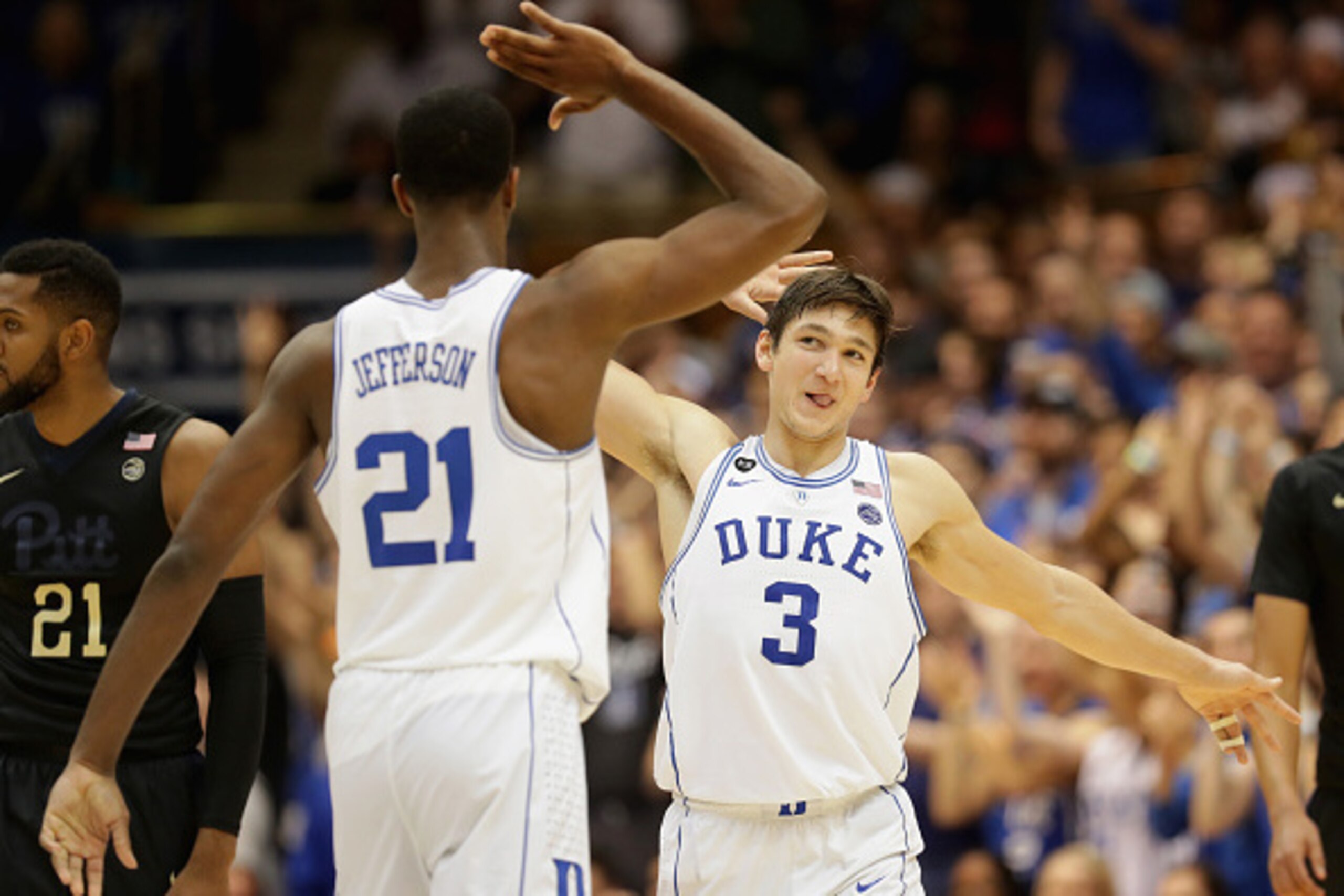 DURHAM, NC - FEBRUARY 04:  Teammates Amile Jefferson #21 and Grayson Allen #3 of the Duke Blue Devils celebrate after a play against the Pittsburgh Panthers during their game at Cameron Indoor Stadium on February 4, 2017 in Durham, North Carolina.  (Photo