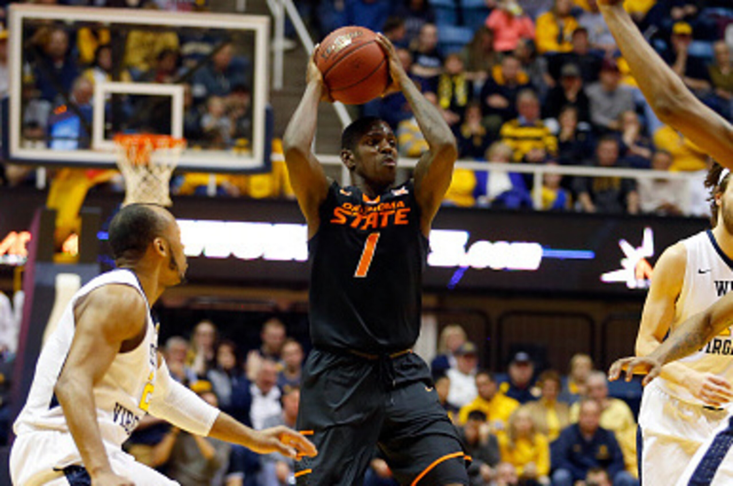 MORGANTOWN, WV - FEBRUARY 04:  Jawun Evans #1 of the Oklahoma State Cowboys looks to pass while the West Virginia Mountaineers press at the WVU Coliseum on February 4, 2017 in Morgantown, West Virginia.  (Photo by Justin K. Aller/Getty Images)