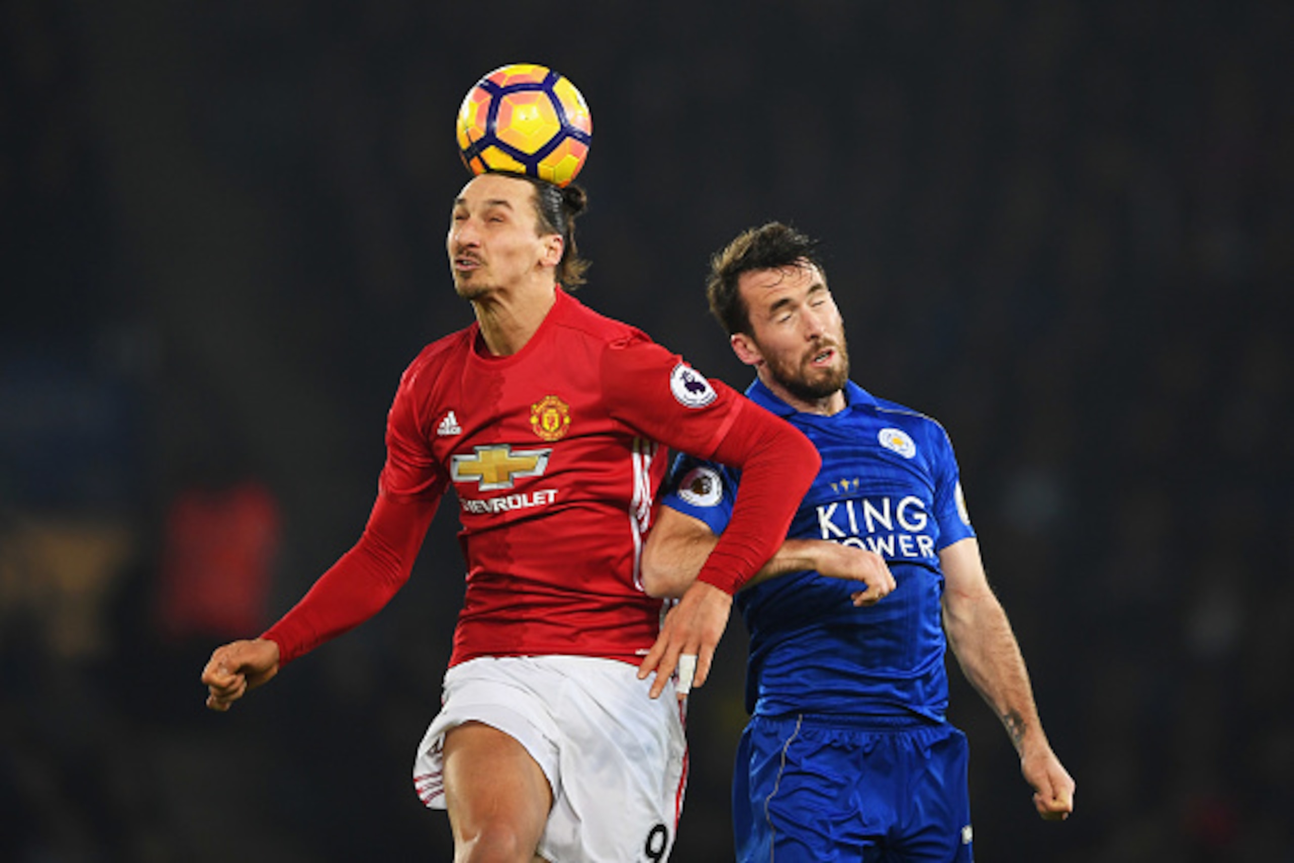 LEICESTER, ENGLAND - FEBRUARY 05:  Zlatan Ibrahimovic of Manchester United beats Christian Fuchs of Leicester City to the ball during the Premier League match between Leicester City and Manchester United at The King Power Stadium on February 5, 2017 in Le