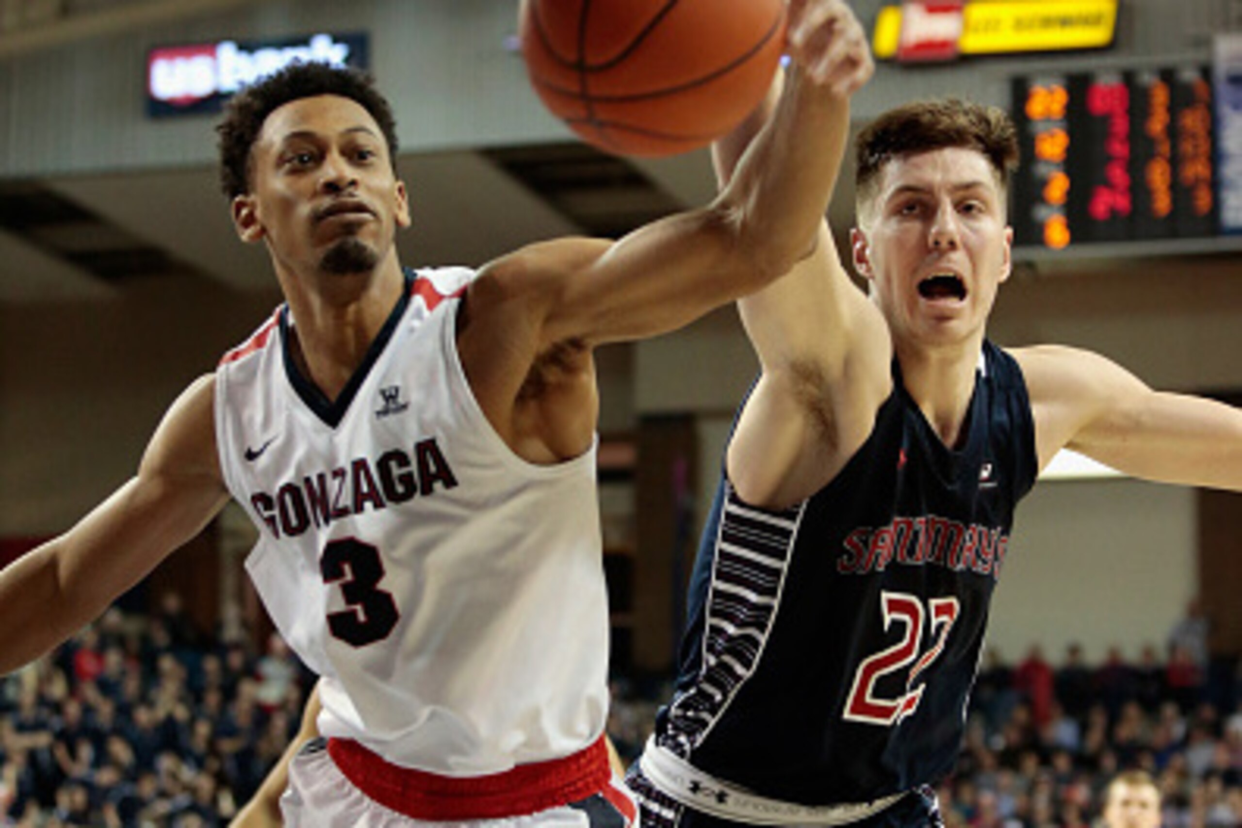 SPOKANE, WA - JANUARY 14:  Johnathan Williams #3 of the Gonzaga Bulldogs and Dane Pineau #22 of the Saint Mary's Gaels battle for possession of a loose ball in the second half at McCarthey Athletic Center on January 14, 2017 in Spokane, Washington.  Gonza