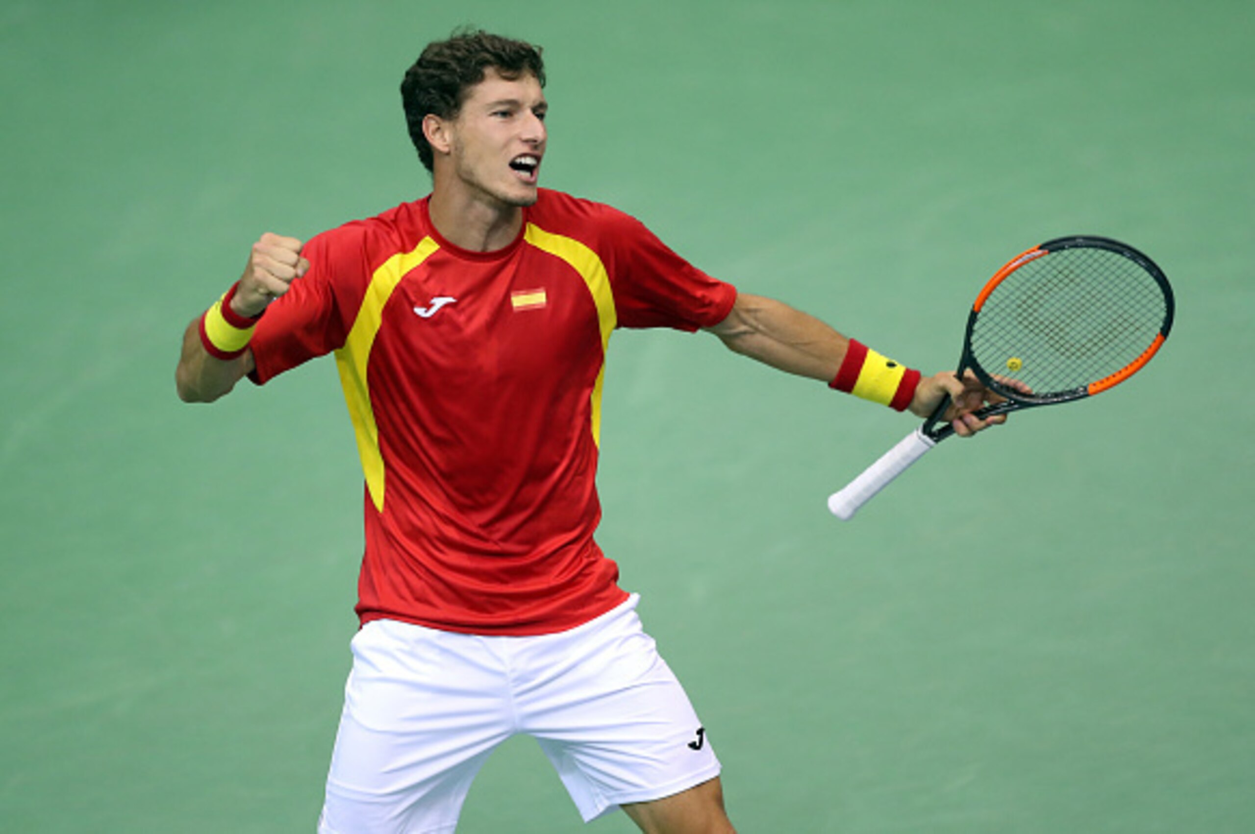 Spain's Pablo Carreno Busta celebrates after winning his singles match against Croatia's Nikola Mektic during the first-round Davis Cup tennis match between Croatia and Spain at Gradski vrt hall in Osijek on February 5, 2017. / AFP / STRINGER        (Phot