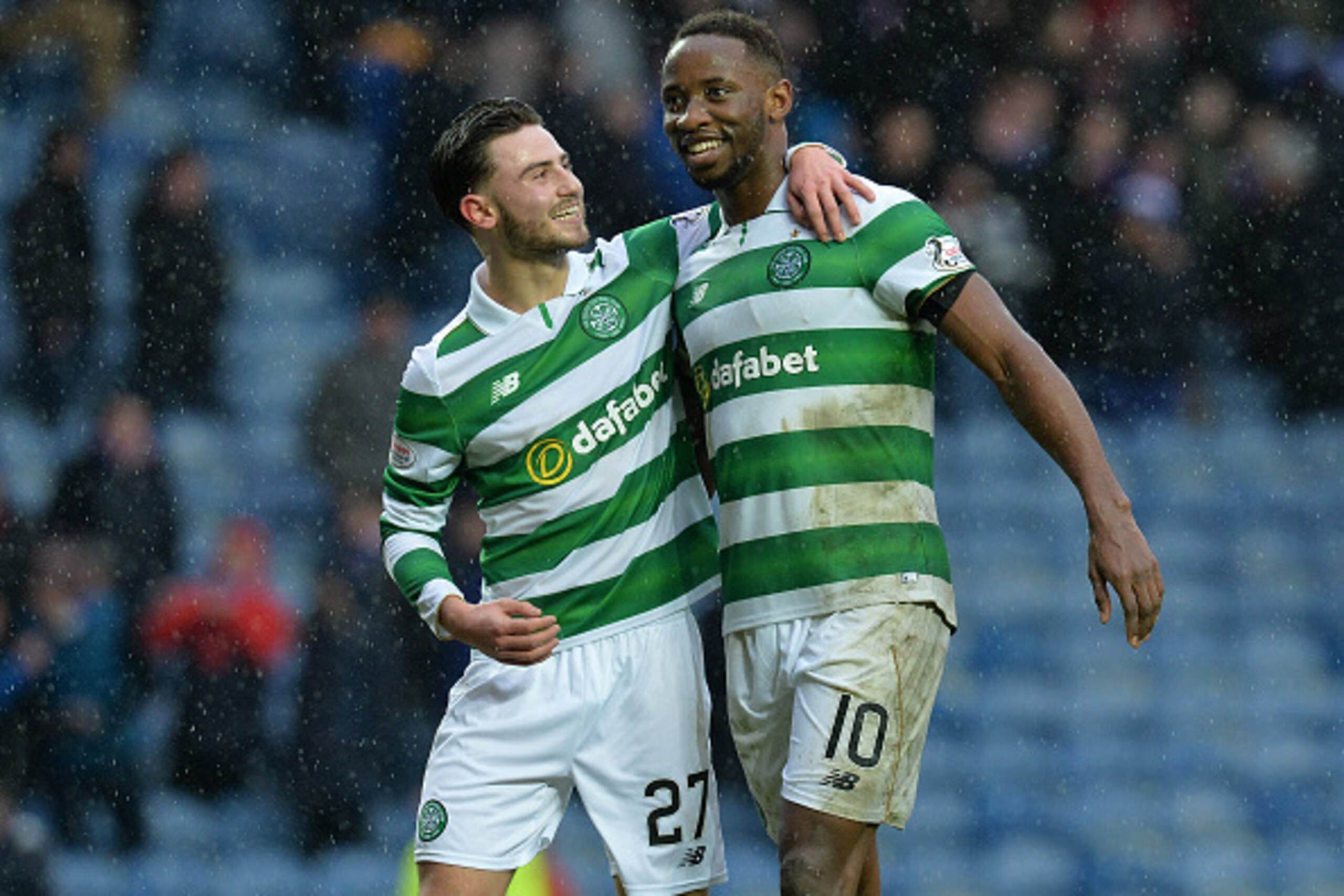 GLASGOW, SCOTLAND - DECEMBER 31: Moussa Dembele of Celtic celebrate at the final Whistle with team mate Patrick Roberts during the Scottish Premiership match between Rangers FC and Celtic FC at Ibrox Stadium on December 31, 2016 in Glasgow, Scotland. (Pho