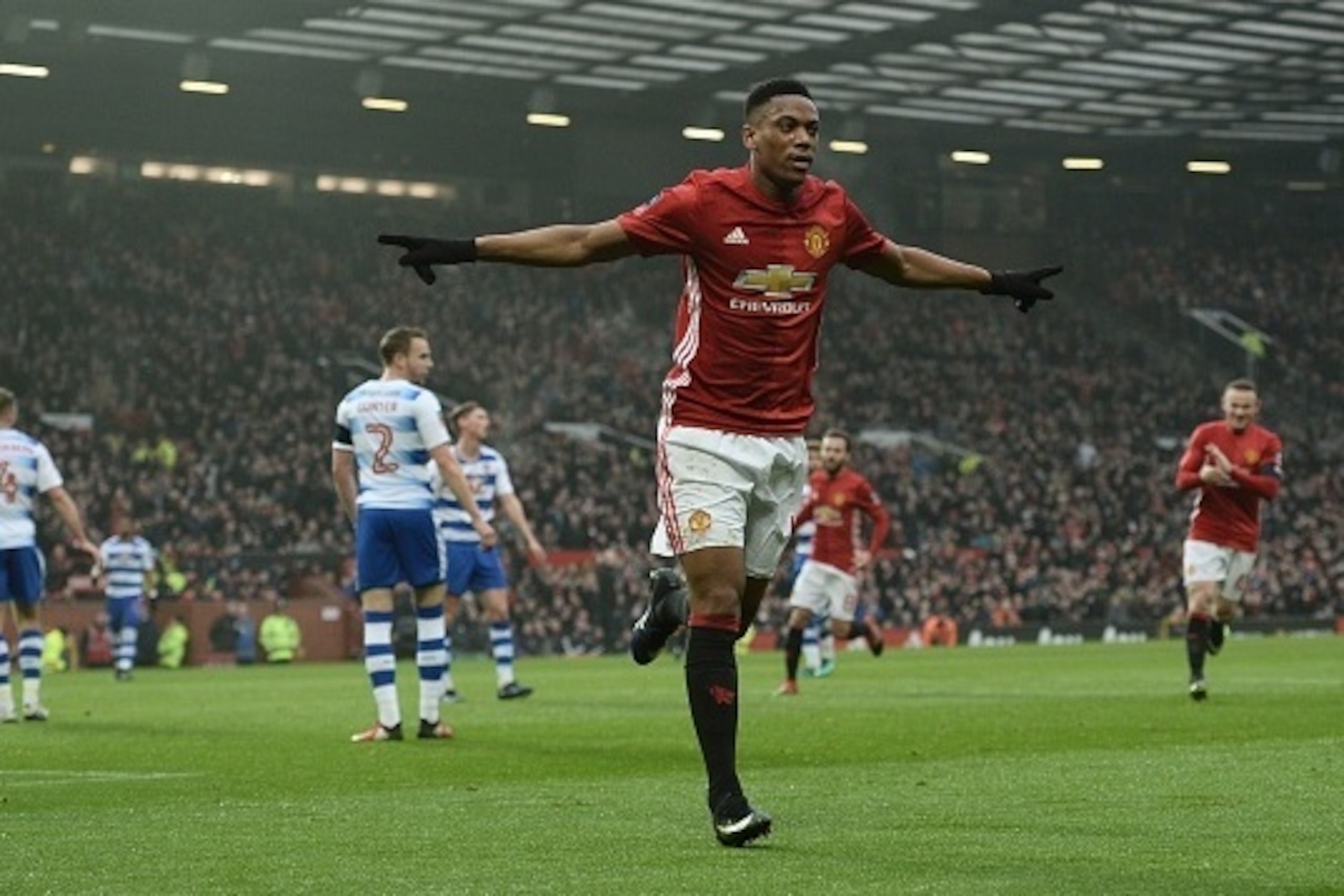 Manchester United's French striker Anthony Martial celebrates scoring their second goal during the English FA Cup third round football match between Manchester United and Reading at Old Trafford in Manchester, north west England, on January 7, 2017. / AFP