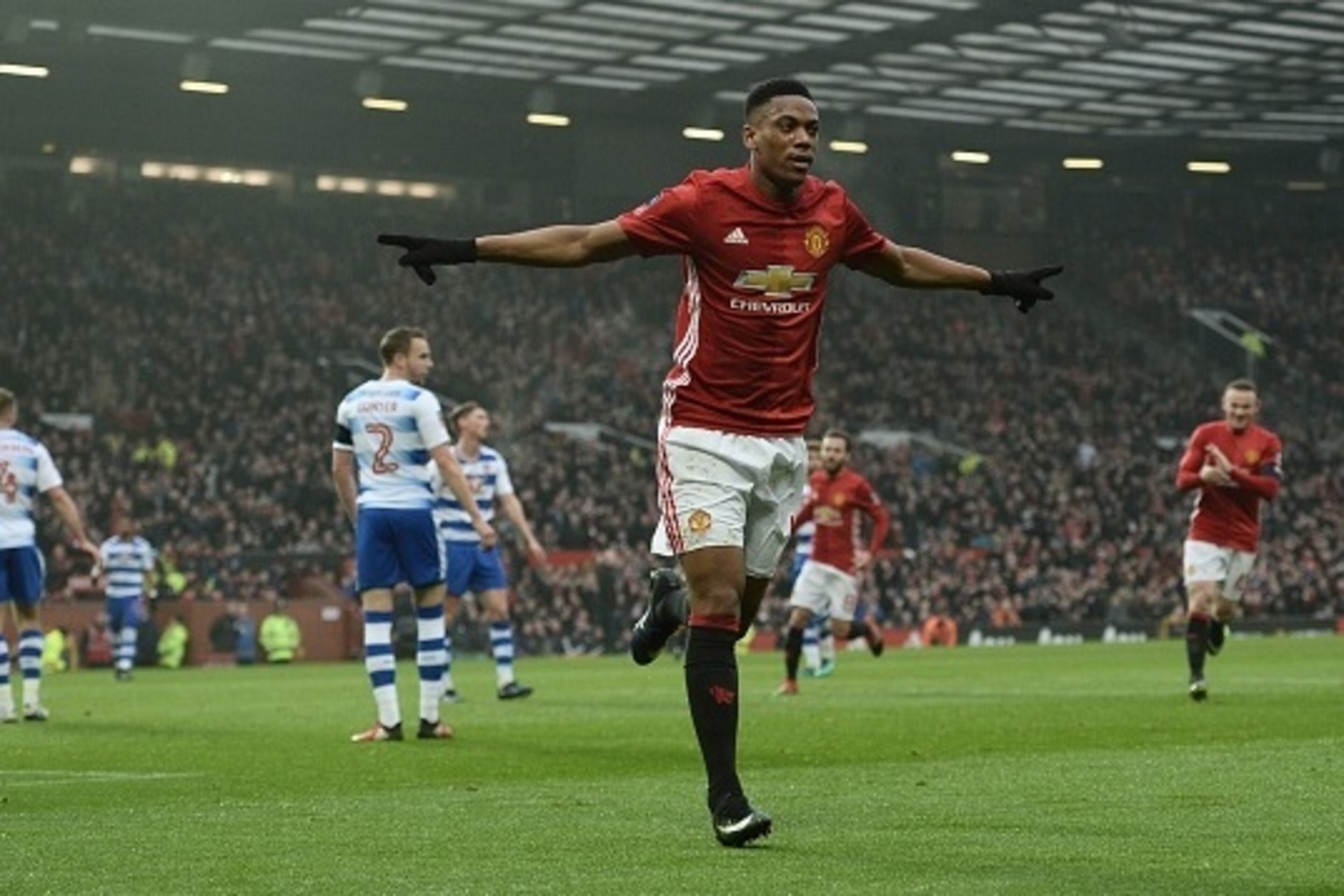 Manchester United's French striker Anthony Martial celebrates scoring their second goal during the English FA Cup third round football match between Manchester United and Reading at Old Trafford in Manchester, north west England, on January 7, 2017. / AFP
