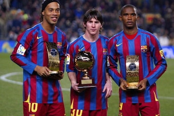 Barcelona, SPAIN:  FC Barcelona's Brazilian Ronaldinho(L) Samuel Eto'o (R) of Cameroon  hold the trophies of FIFA World Player of the Year and Argentinian Leo Messi with his Golden Boy trophy   before the Spanish League football match against Celta at the