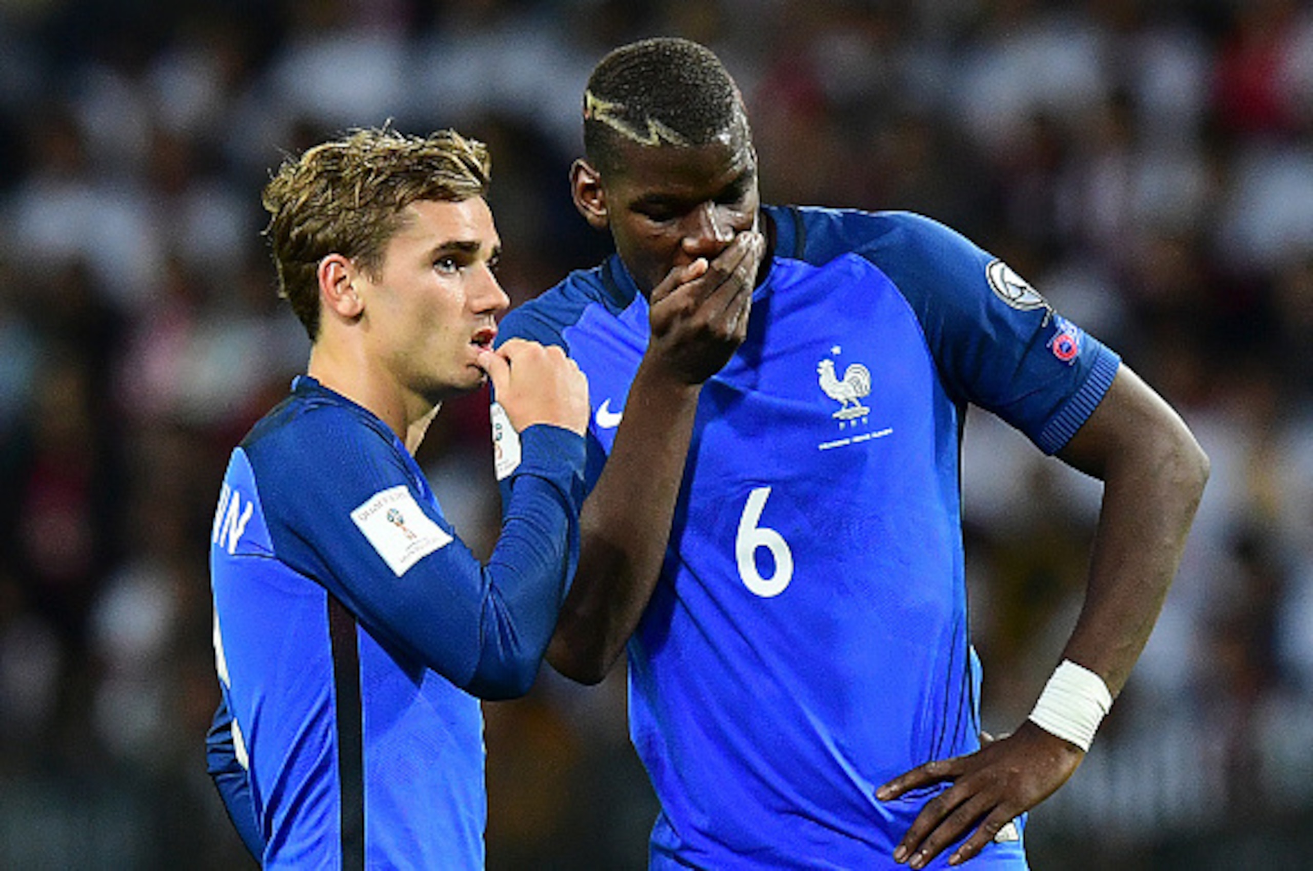 France's forward Antoine Griezmann (L) speaks with France's midfielder Paul Pogba during the FIFA World Cup 2018 qualifying football match Belarus vs France on September 6, 2016 at the Borisov Arena in Borisov. / AFP / FRANCK FIFE (Photo credit s France's forward Antoine Griezmann (L) speaks with France's midfielder Paul Pogba during the FIFA World Cup 2018 qualifying football match Belarus vs France on September 6, 2016 at the Borisov Arena in Borisov. / AFP / FRANCK FIFE (Photo credit s