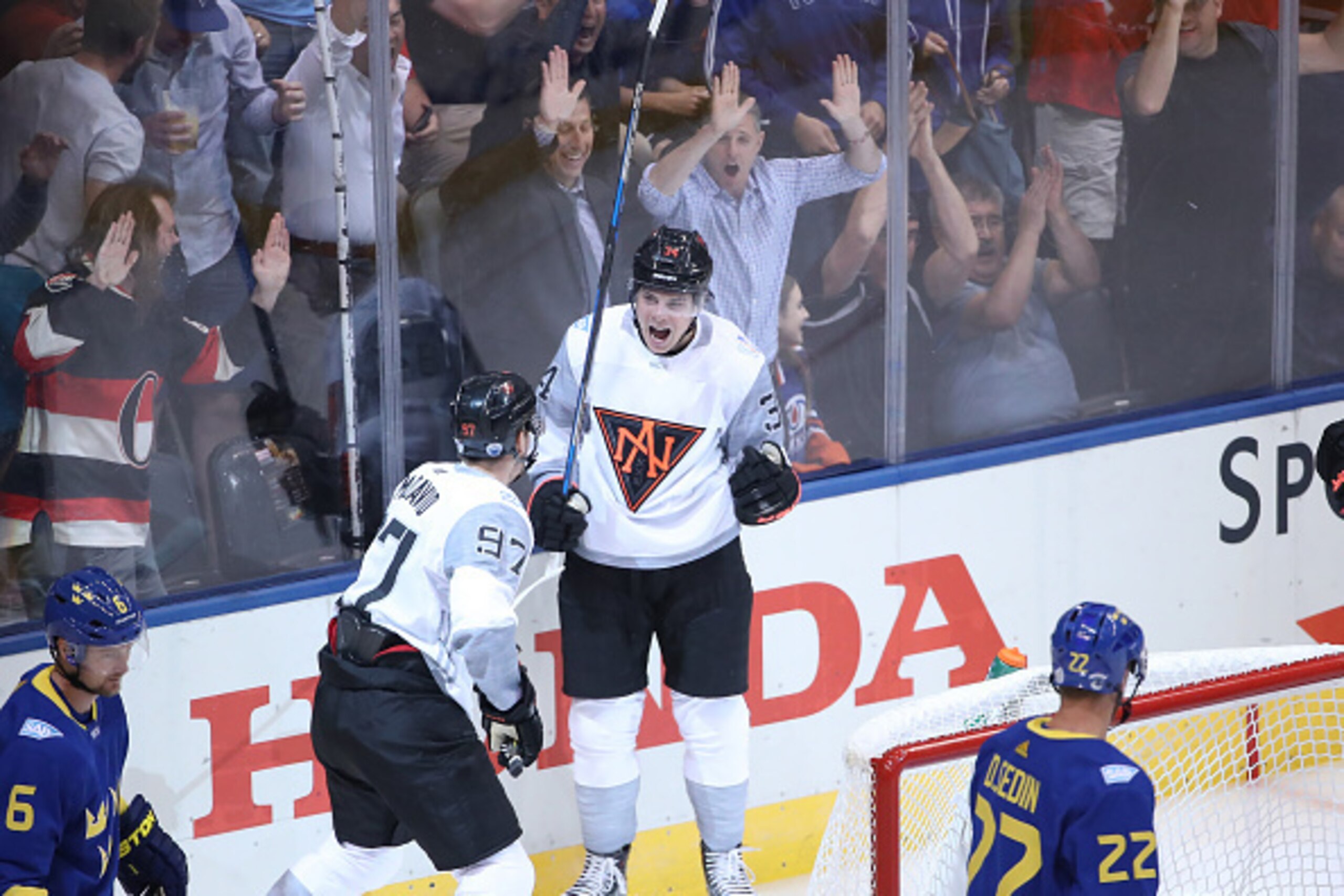 TORONTO, ON - SEPTEMBER 21: Auston Matthews #34 of Team North America celebrates his first period power play goal with Connor McDavid #97 against Team Sweden during the World Cup of Hockey tournament at the Air Canada Centre on September 21, 2016 in Toron