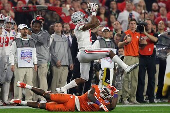 GLENDALE, AZ - DECEMBER 31:  Gareon Conley #8 of the Ohio State Buckeyes intercepts a pass intended for Mike Williams #7 of the Clemson Tigers during the first half of the 2016 PlayStation Fiesta Bowl at University of Phoenix Stadium on December 31, 2016 